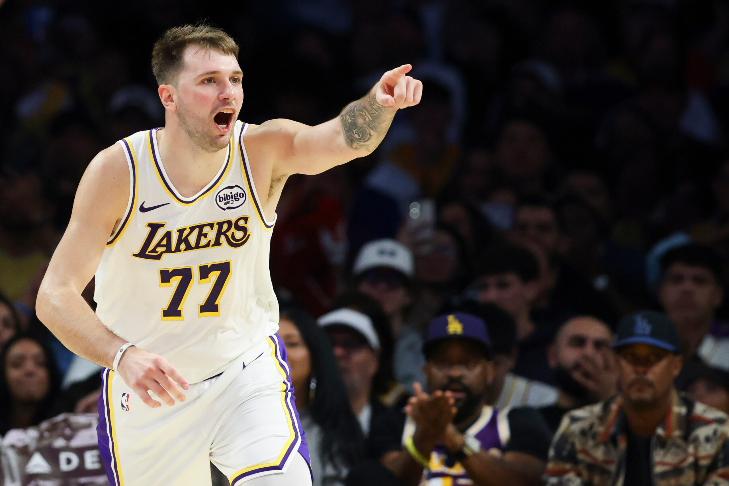 Lakers guard Luka Doncic (77) reacts after scoring a basket...