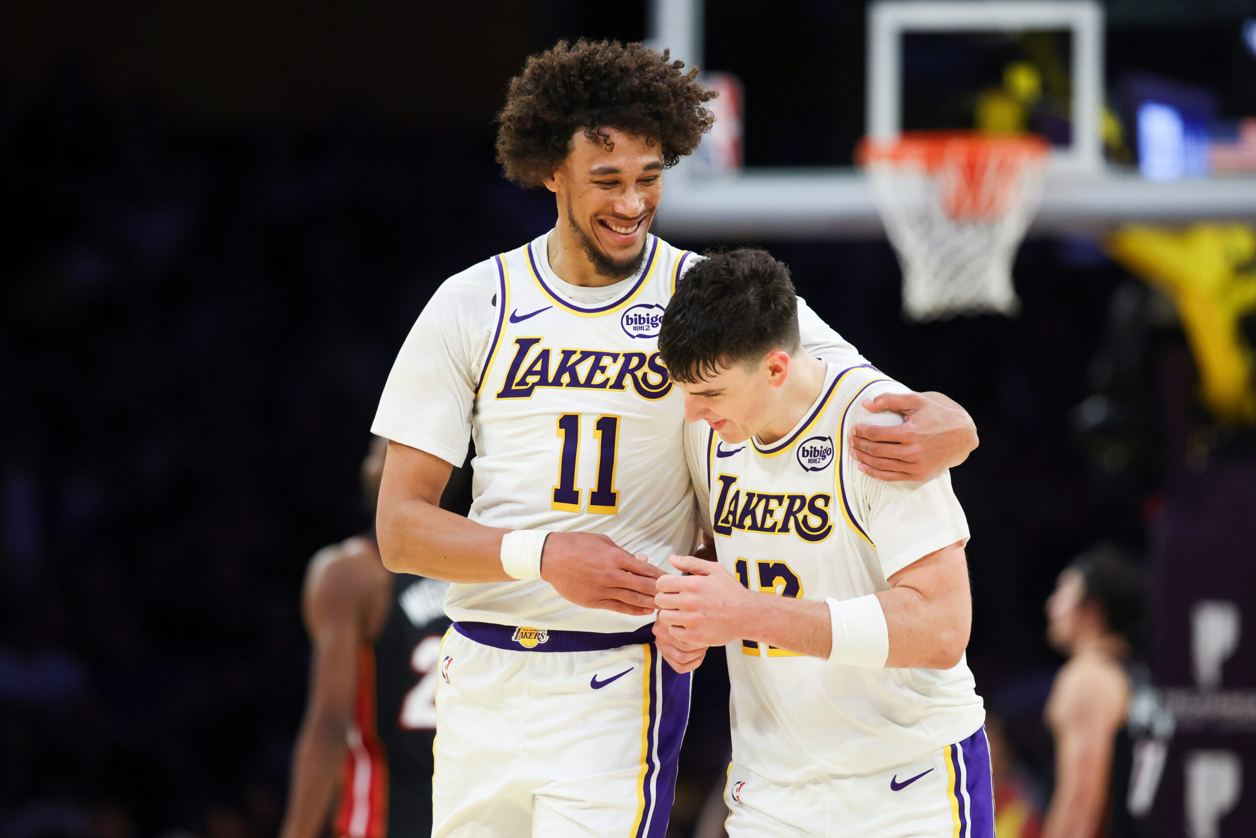 Lakers center Jaxson Hayes (11) and forward Jake LaRavia, right,...