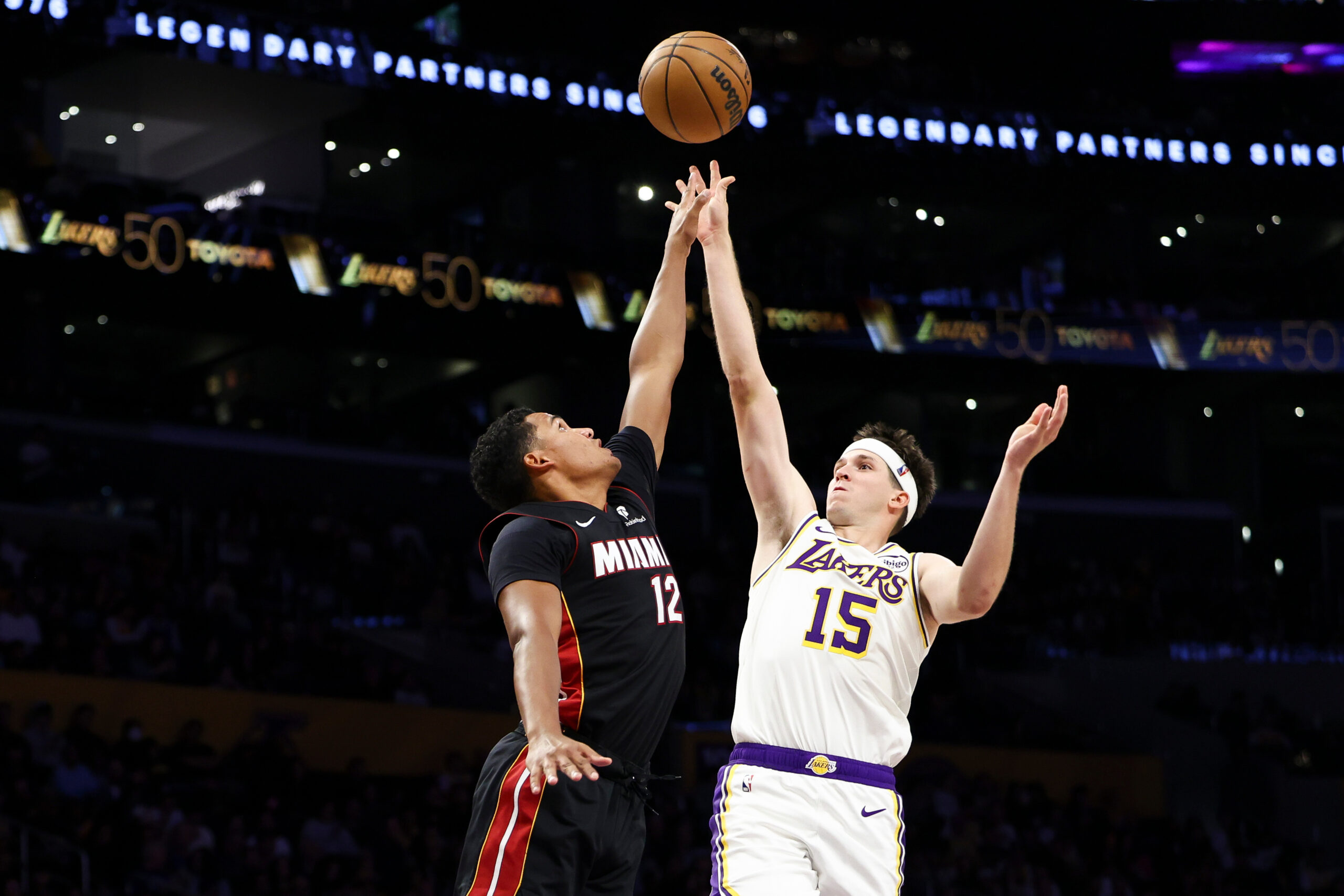 Lakers guard Austin Reaves (15) shoots against Miami Heat guard...