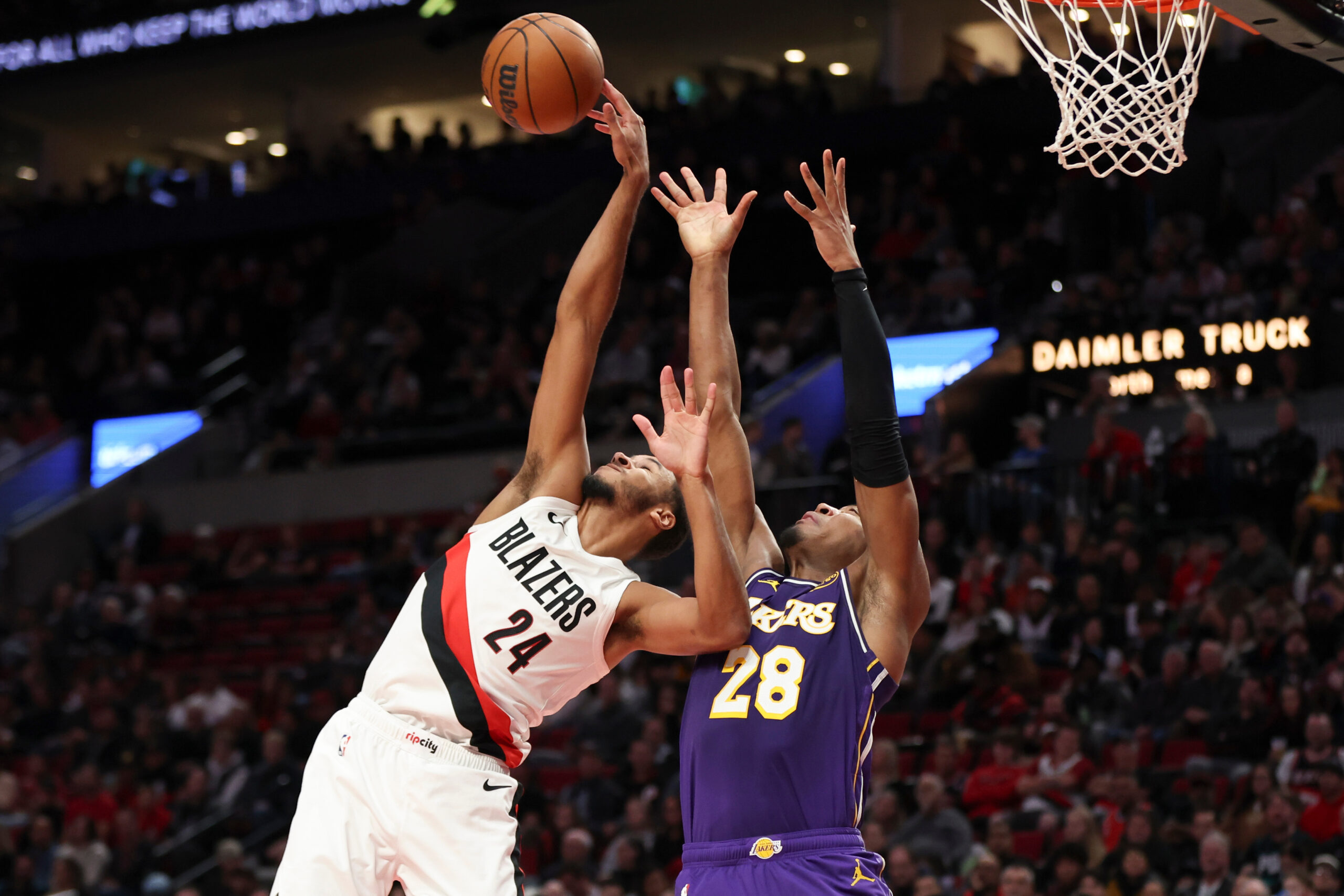 Portland Trail Blazers forward Kris Murray (24) and Lakers forward...