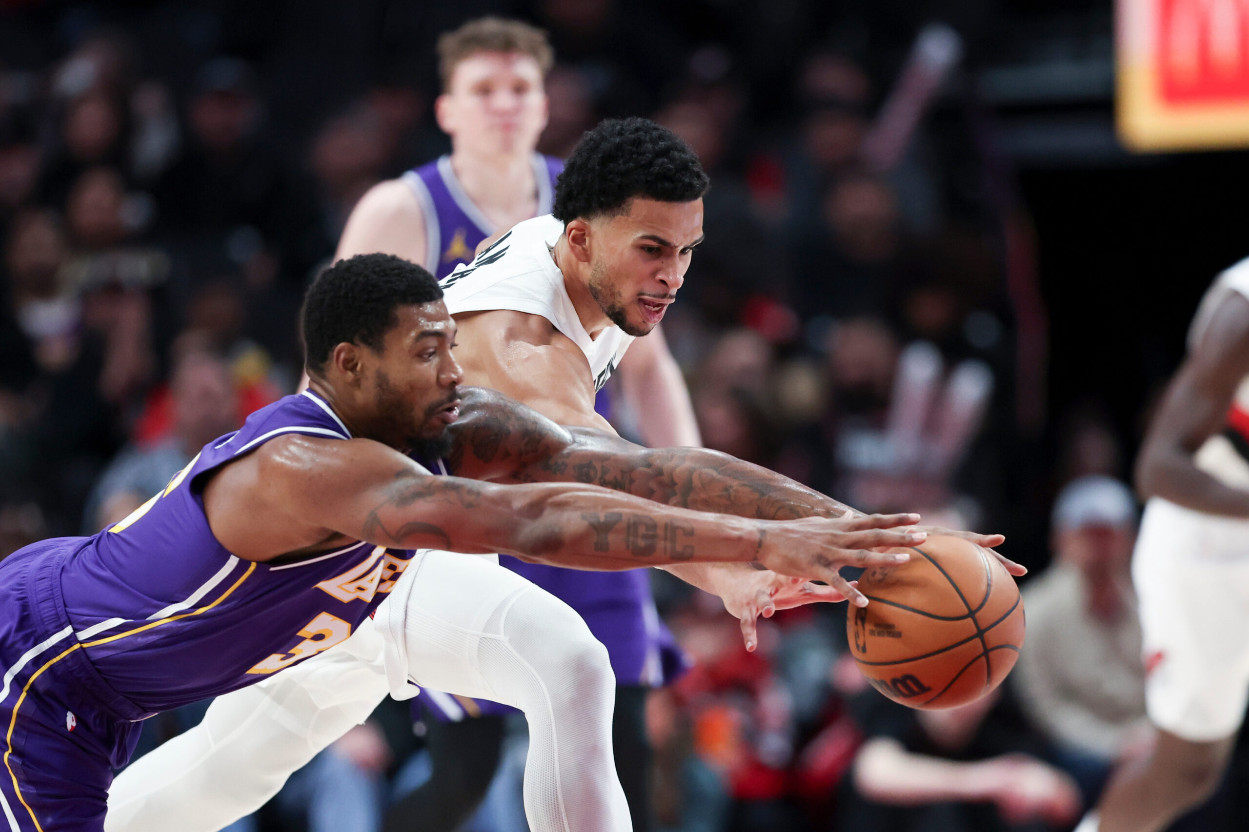 Lakers guard Marcus Smart, left, and Portland Trail Blazers forward...