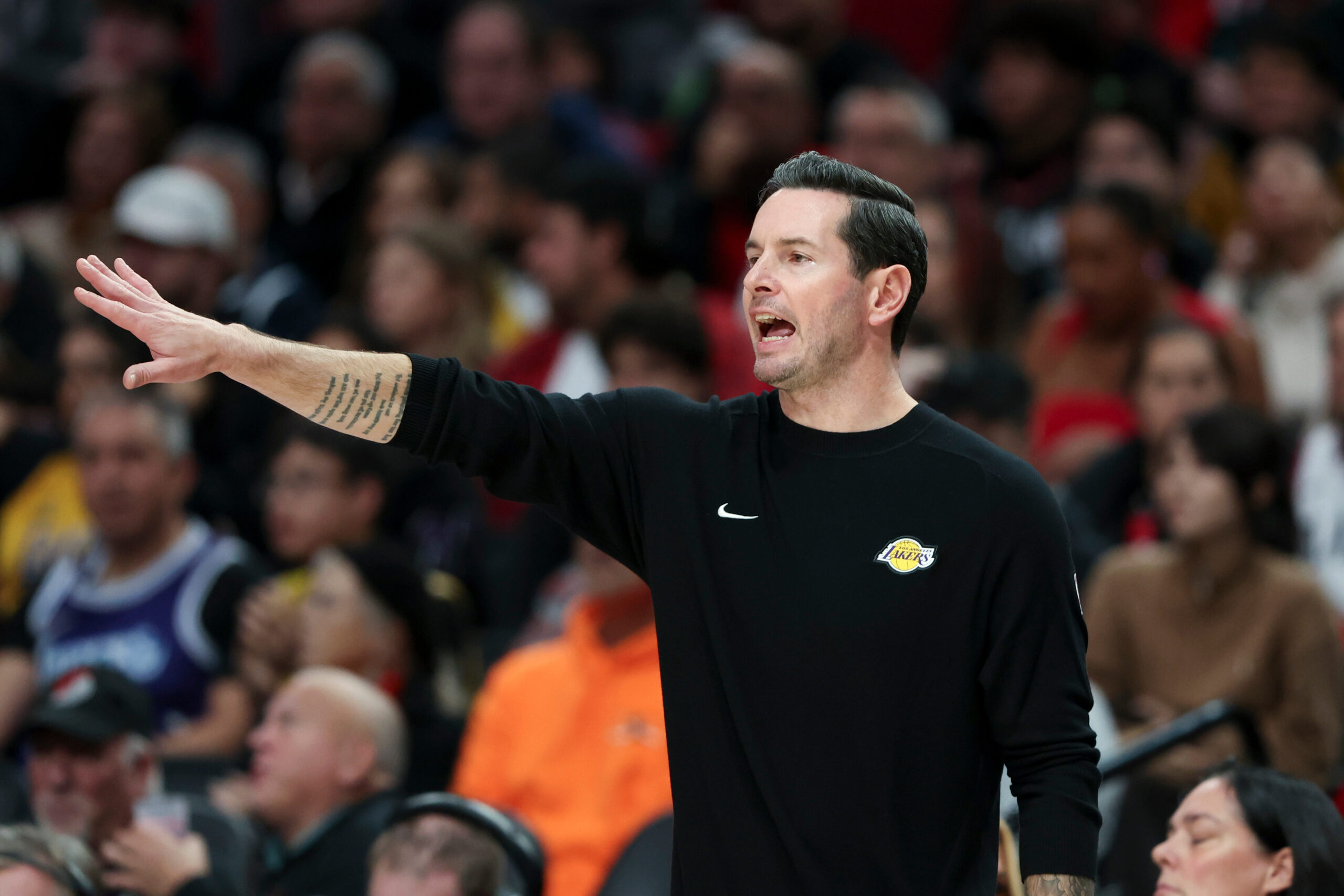 Lakers head coach JJ Redick calls out to players during...