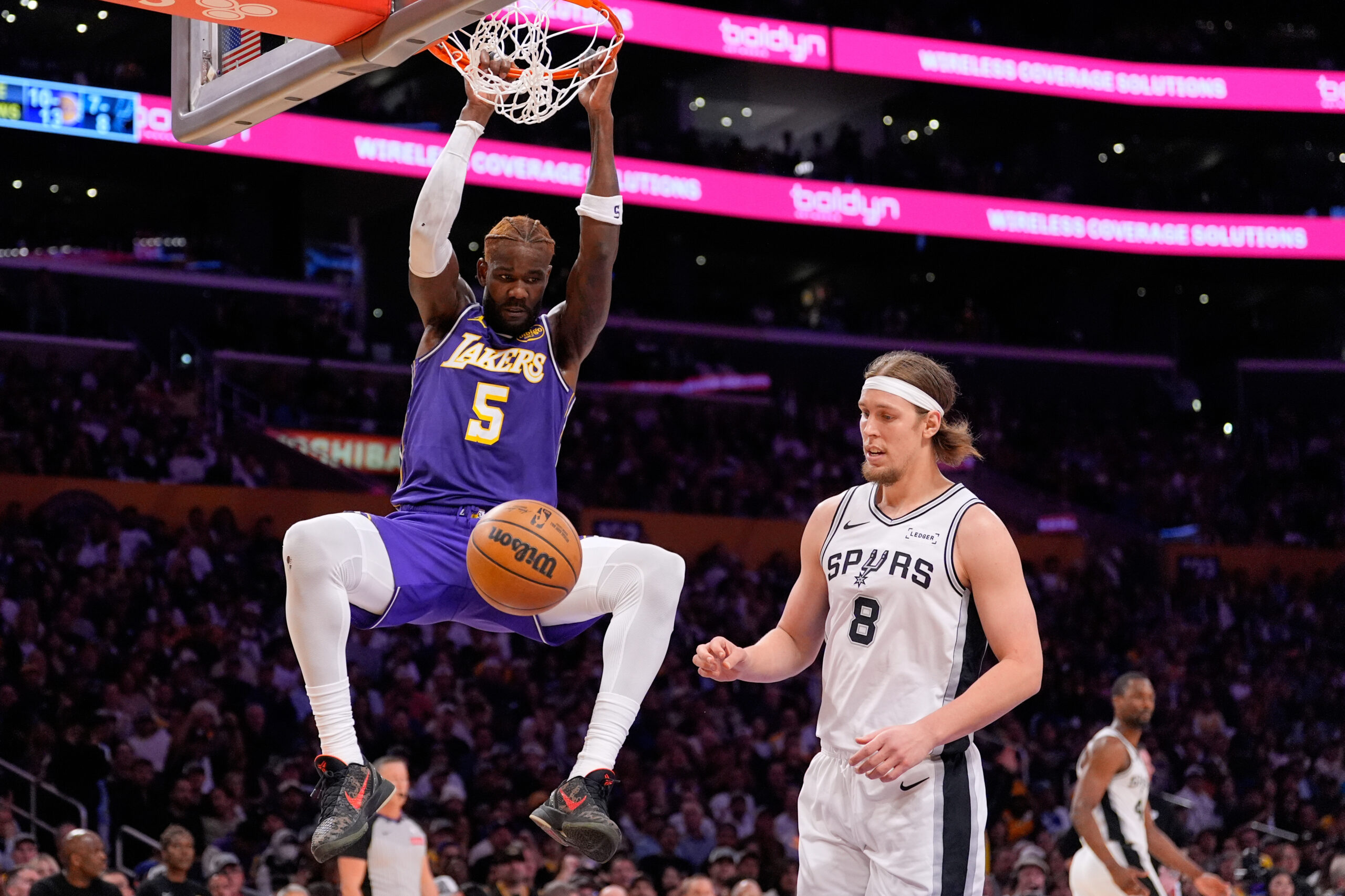 Lakers center Deandre Ayton dunks as San Antonio Spurs forward...