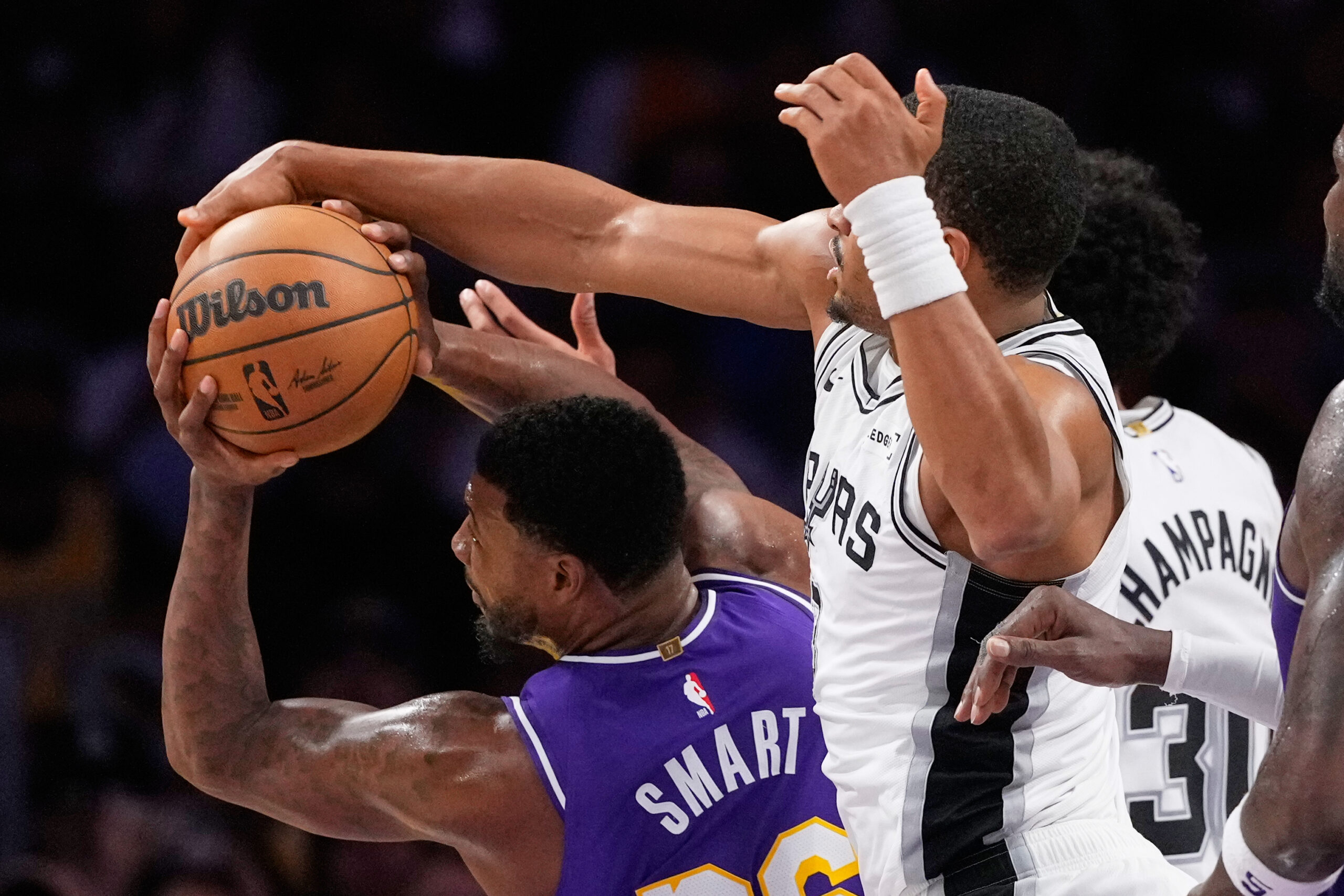 Lakers guard Marcus Smart, left, and San Antonio Spurs forward...