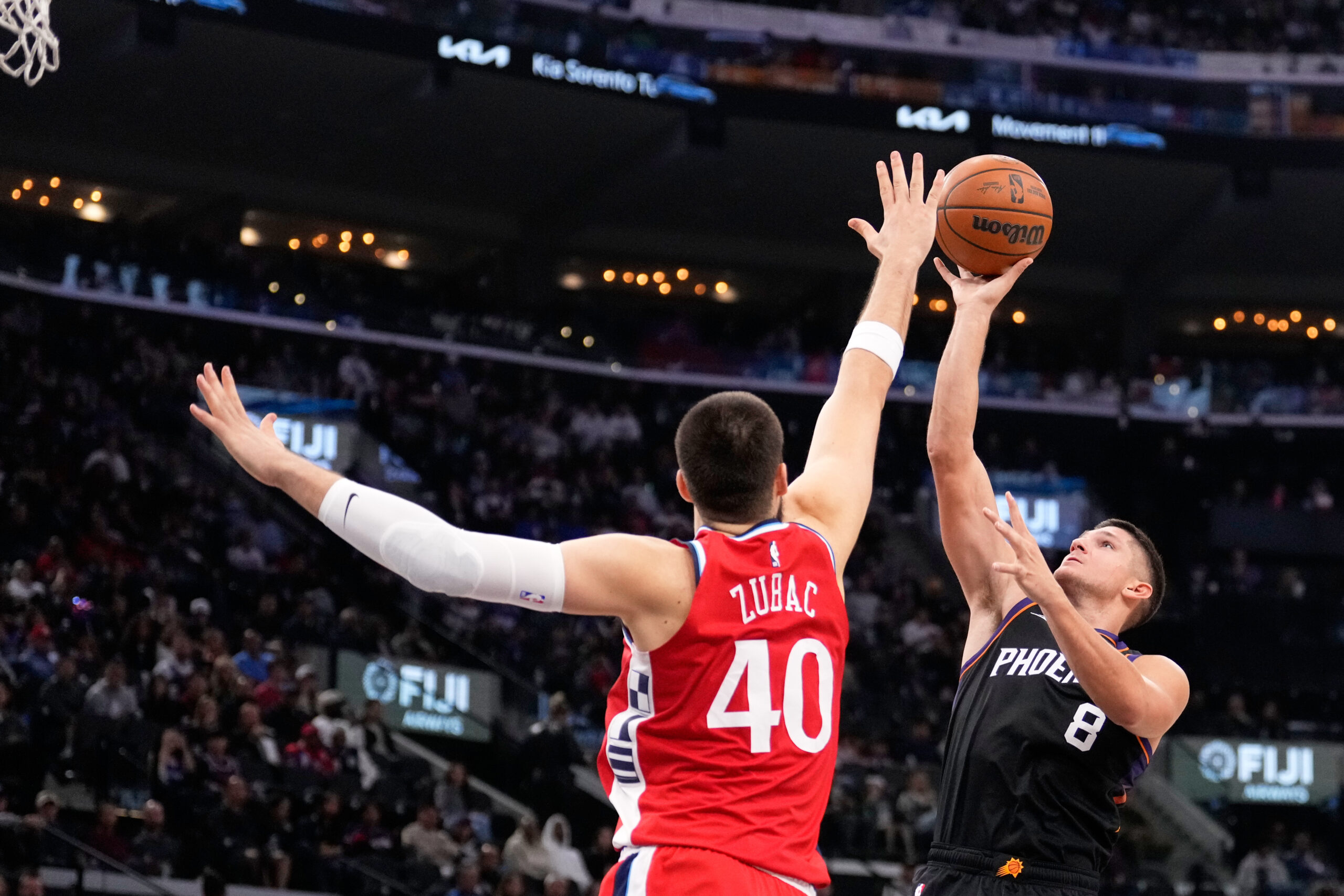 Phoenix Suns guard Grayson Allen, right, shoots as Clippers center...
