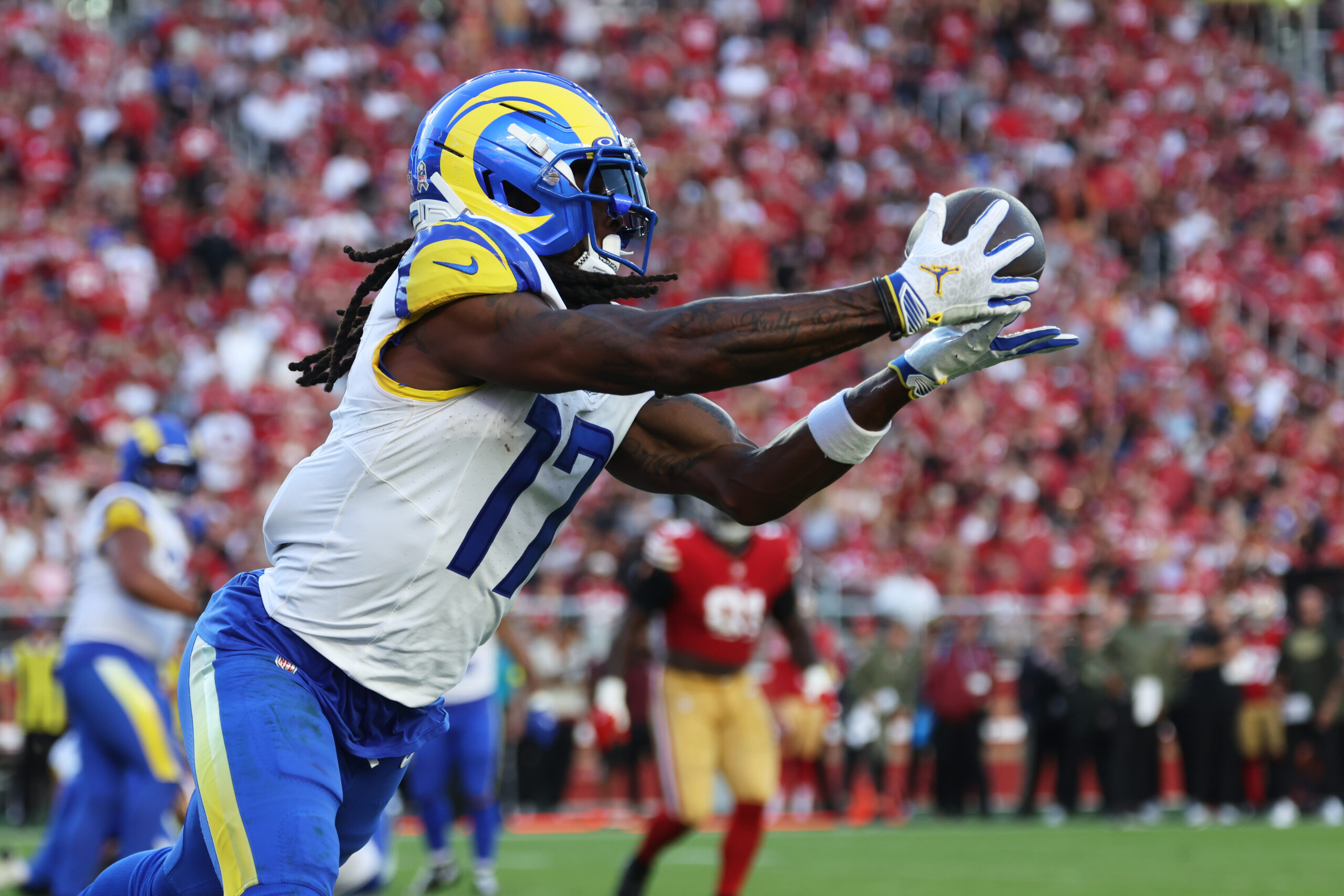 Rams wide receiver Davante Adams (17) catches a touchdown pass...