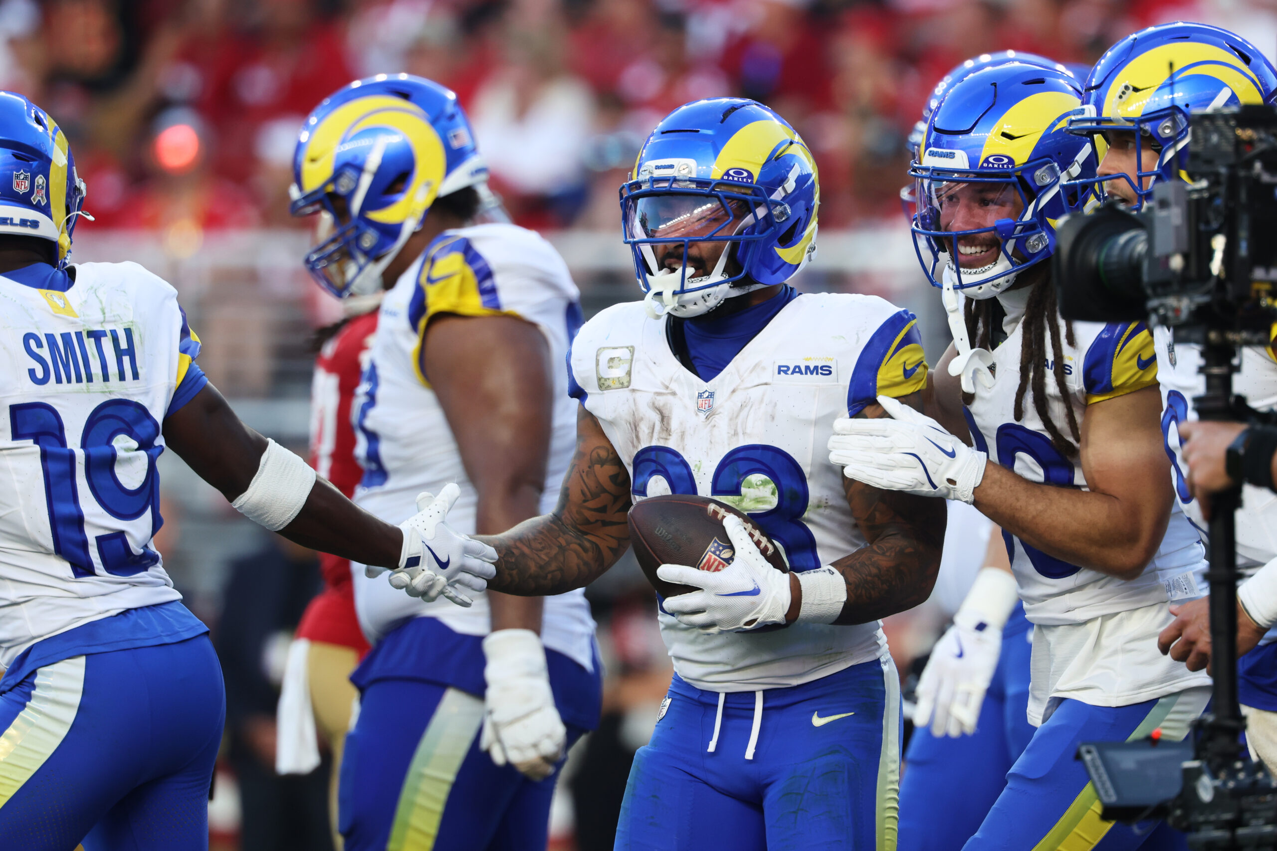 Rams running back Kyren Williams, middle, is congratulated by teammates...