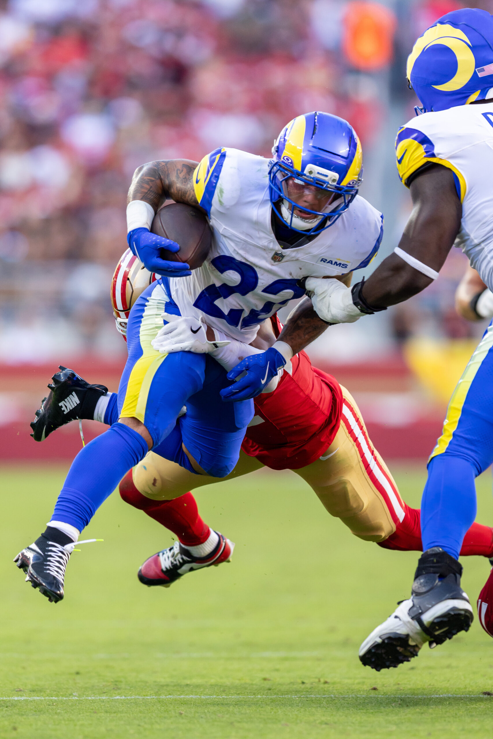 Rams running back Blake Corum (22) runs the ball against...