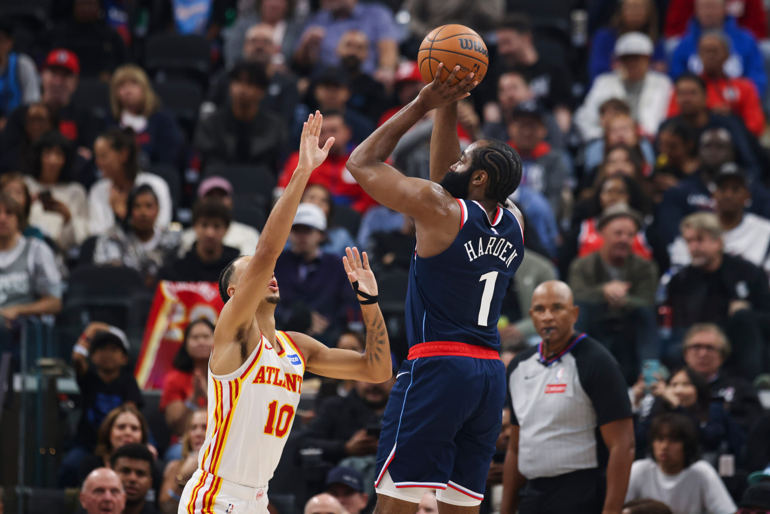 Clippers guard James Harden shoots as Atlanta Hawks forward Zaccharie...