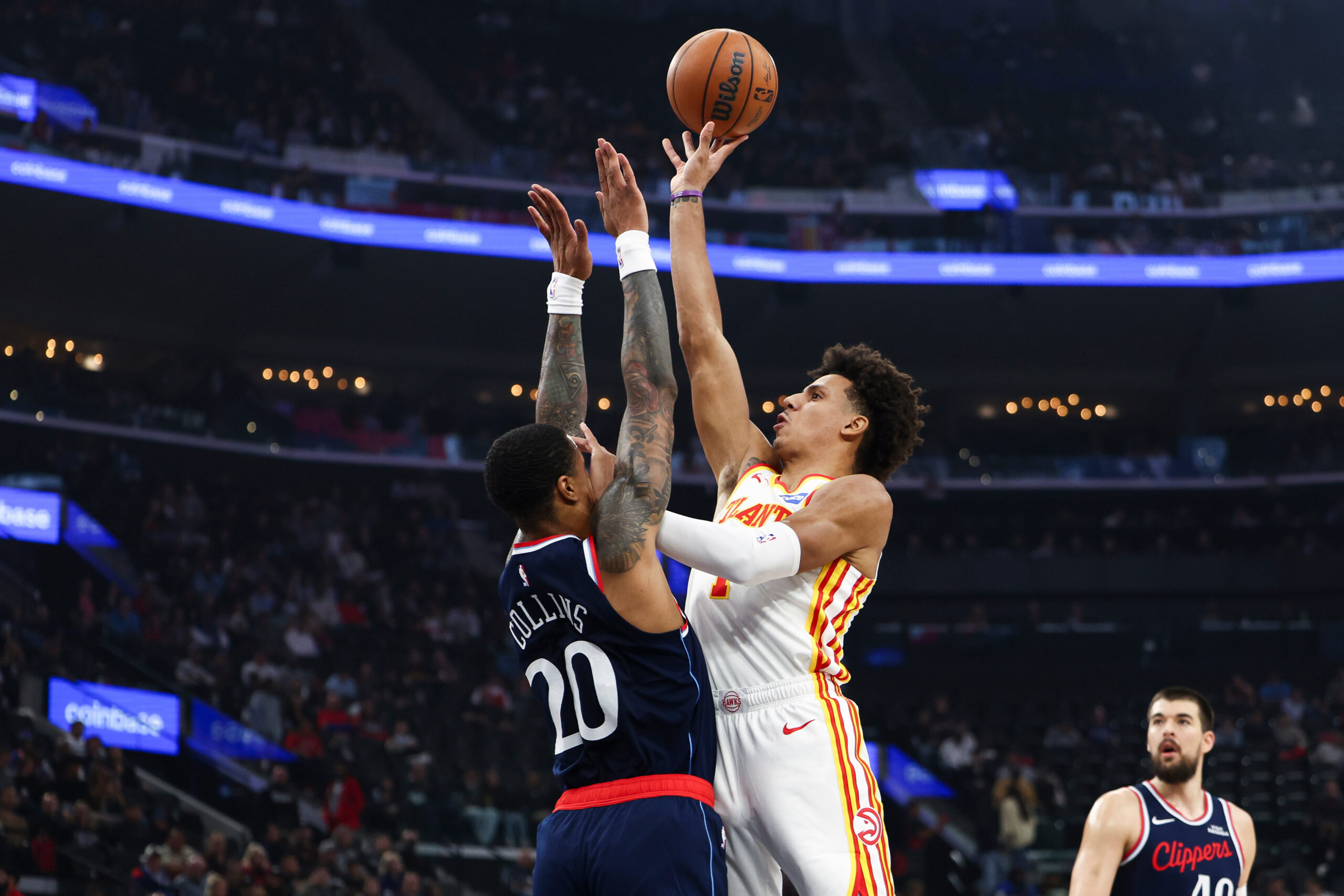 Atlanta Hawks forward Jalen Johnson, right, drives against Clippers forward...