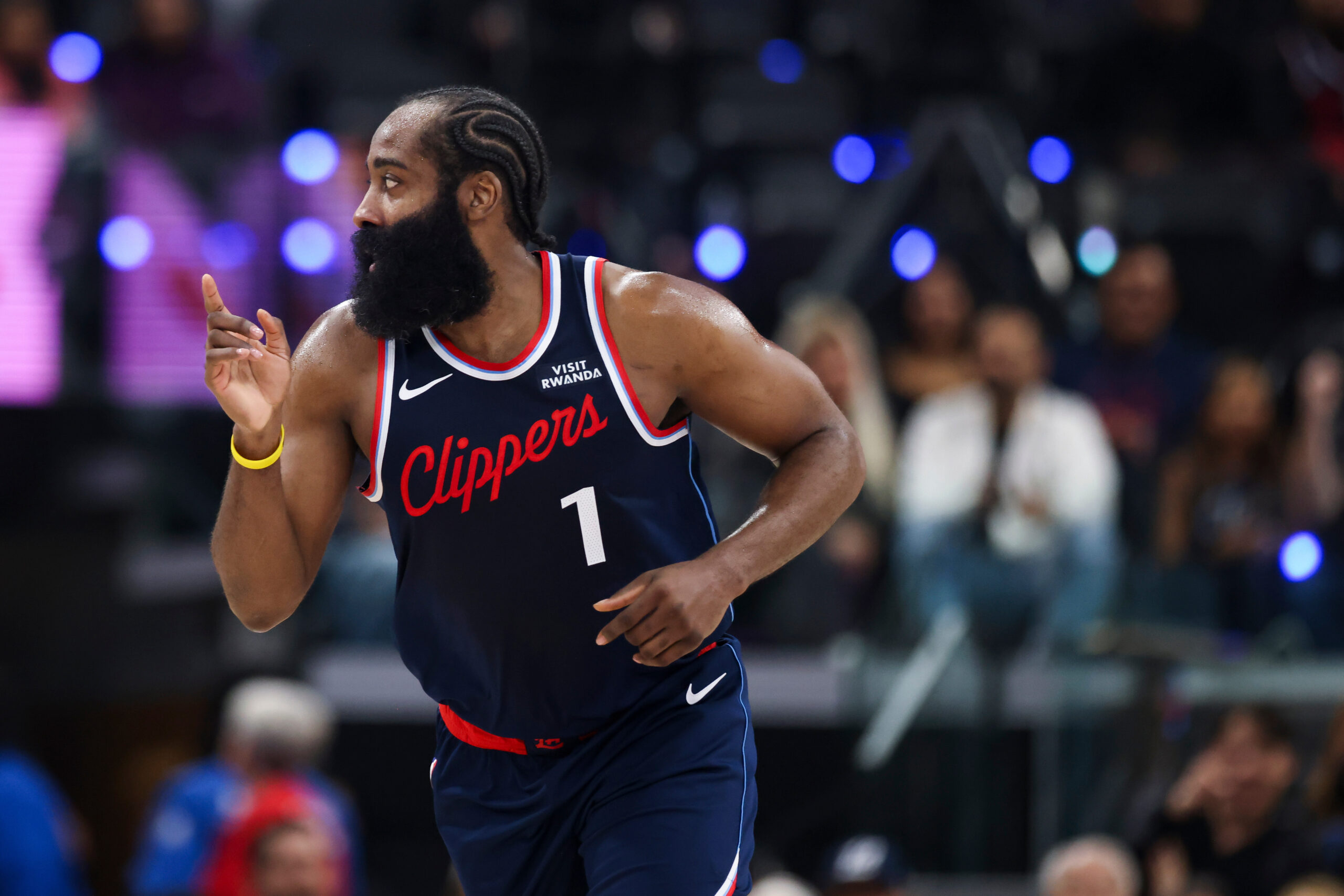 Clippers guard James Harden gestures after scoring a basket during...