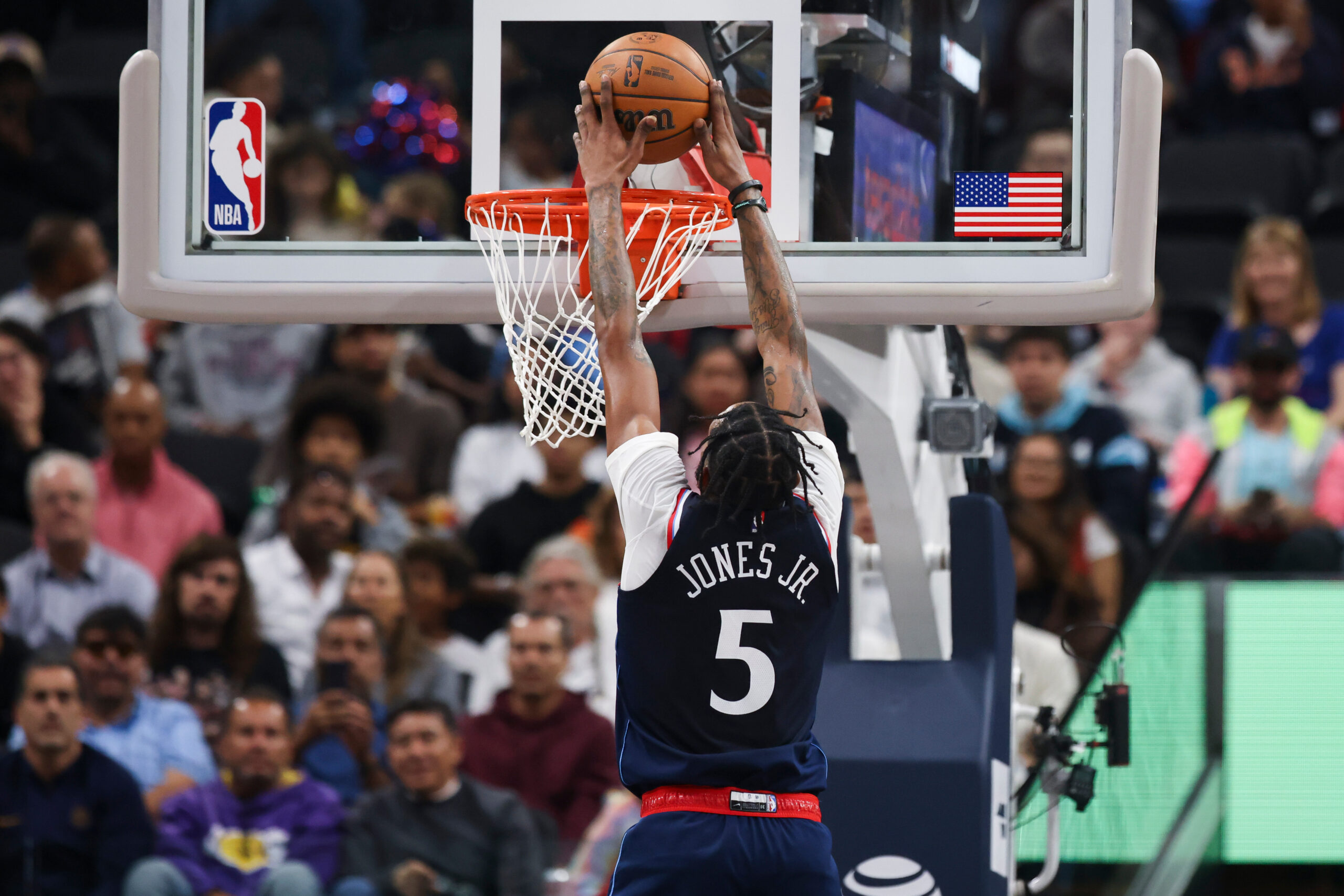 Clippers forward Derrick Jones Jr. dunks during the first half...