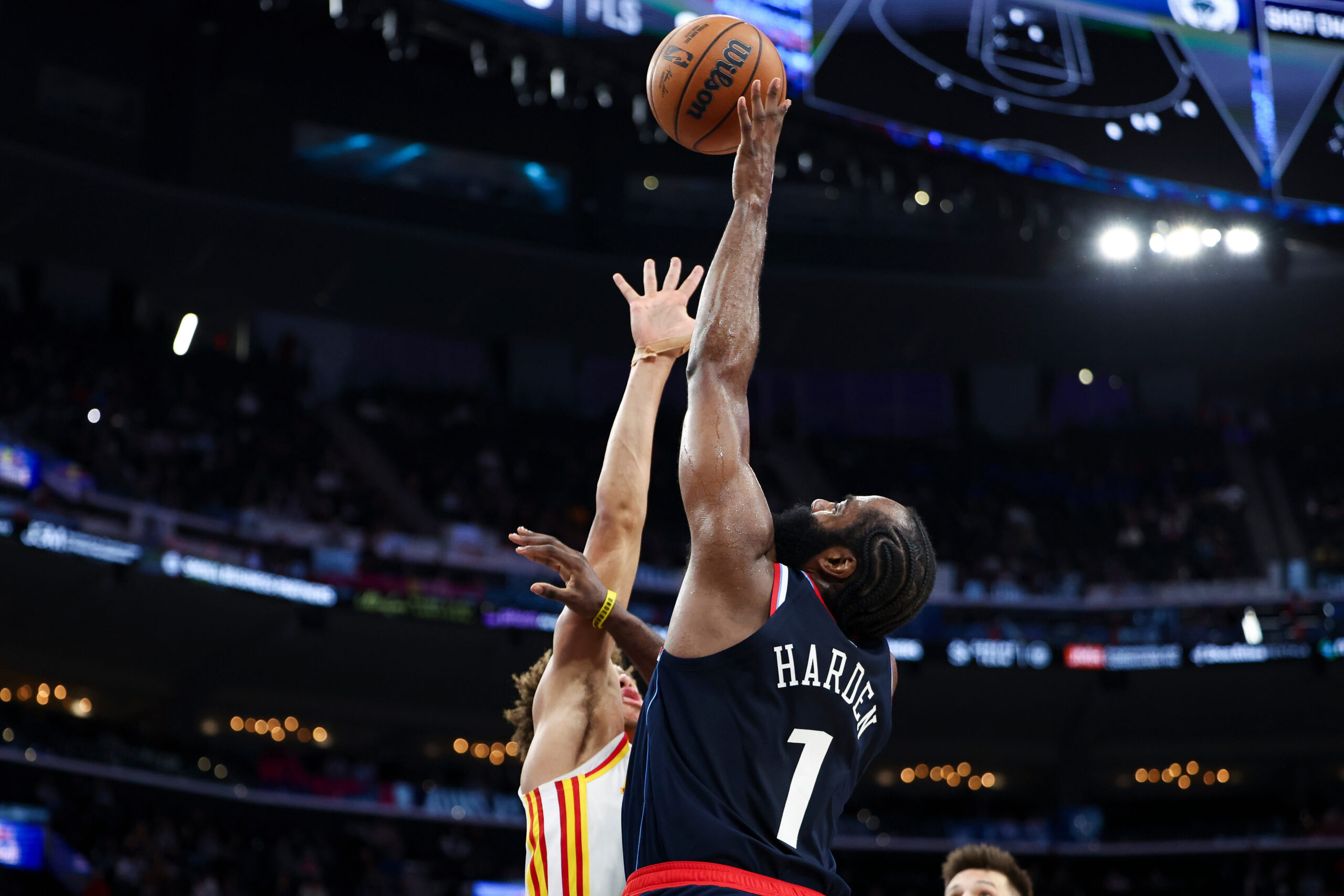 Clippers guard James Harden drives against Atlanta Hawks guard Dyson...
