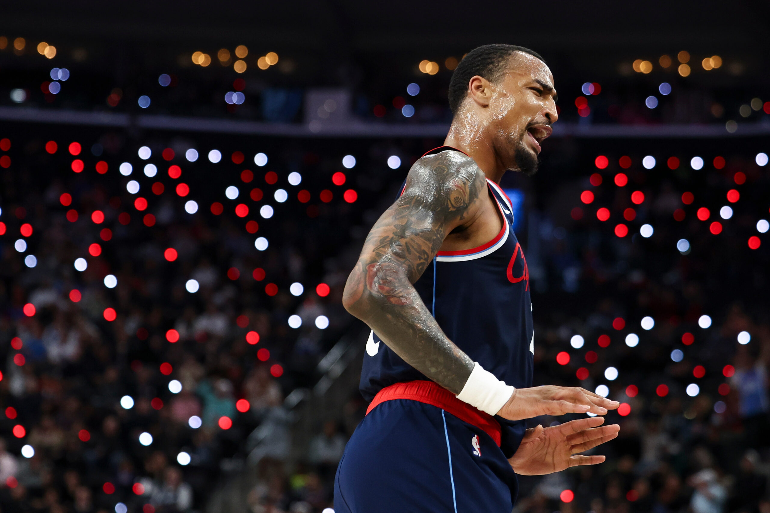 Clippers forward John Collins reacts after making a 3-point shot...