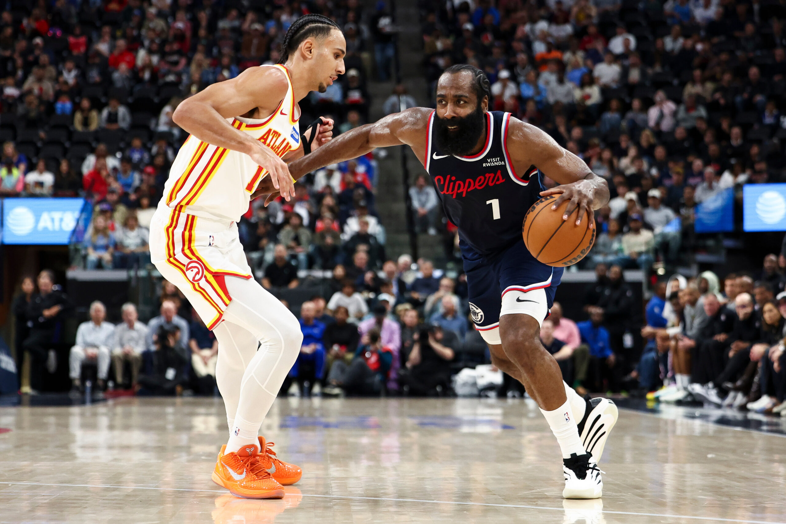 Clippers guard James Harden drives against Atlanta Hawks forward Zaccharie...