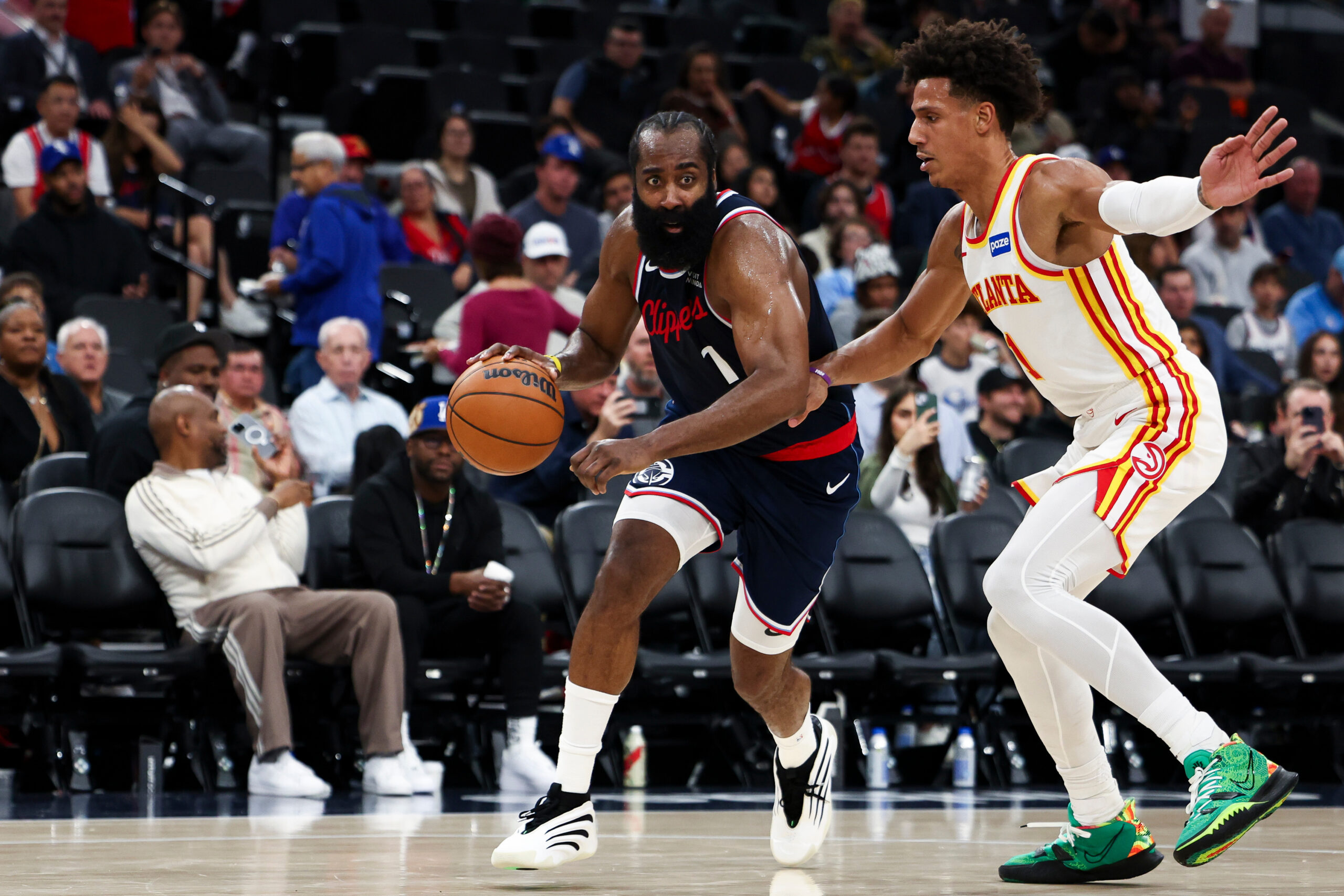 Clippers guard James Harden dribbles against Atlanta Hawks forward Jalen...