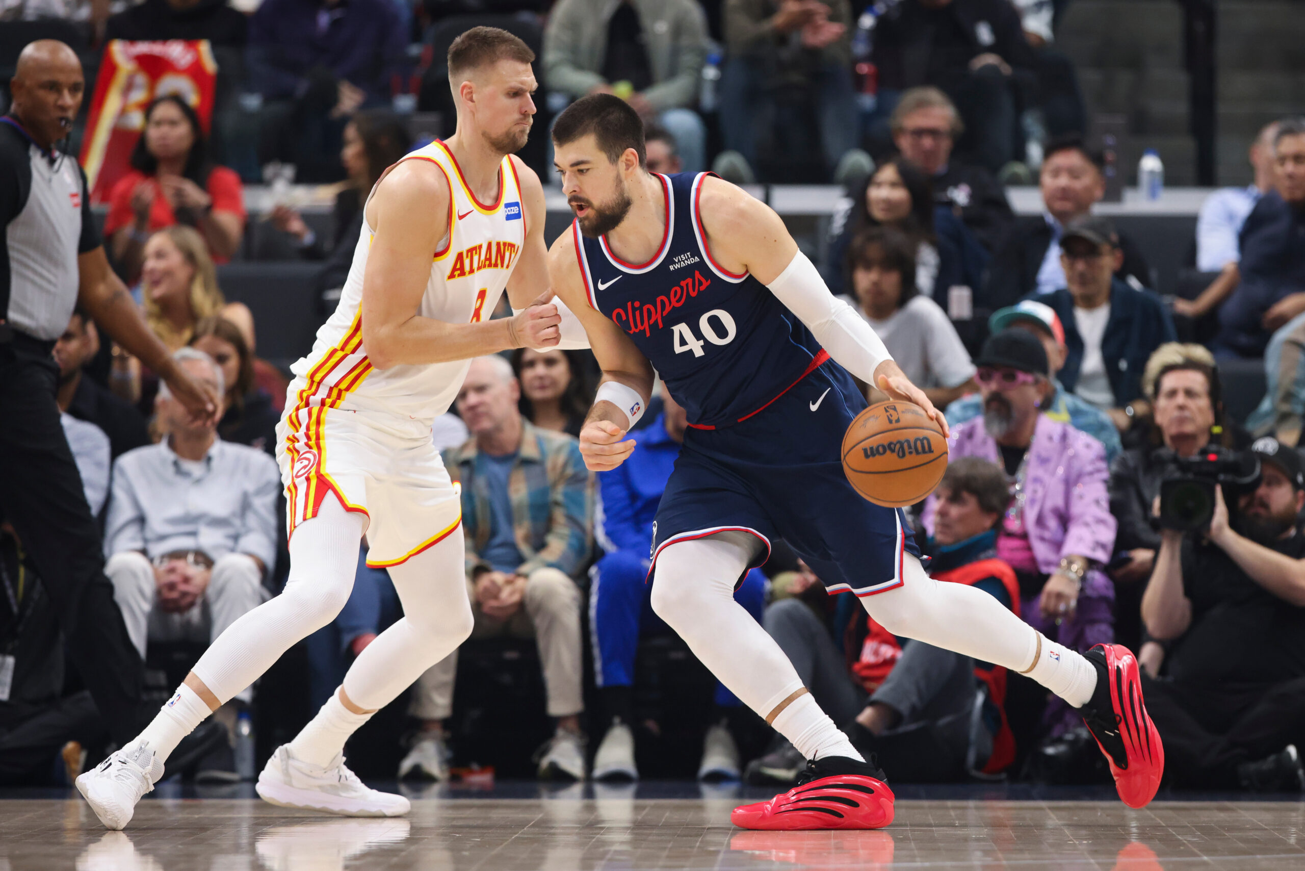 Clippers center Ivica Zubac (40) dribbles against Atlanta Hawks center...