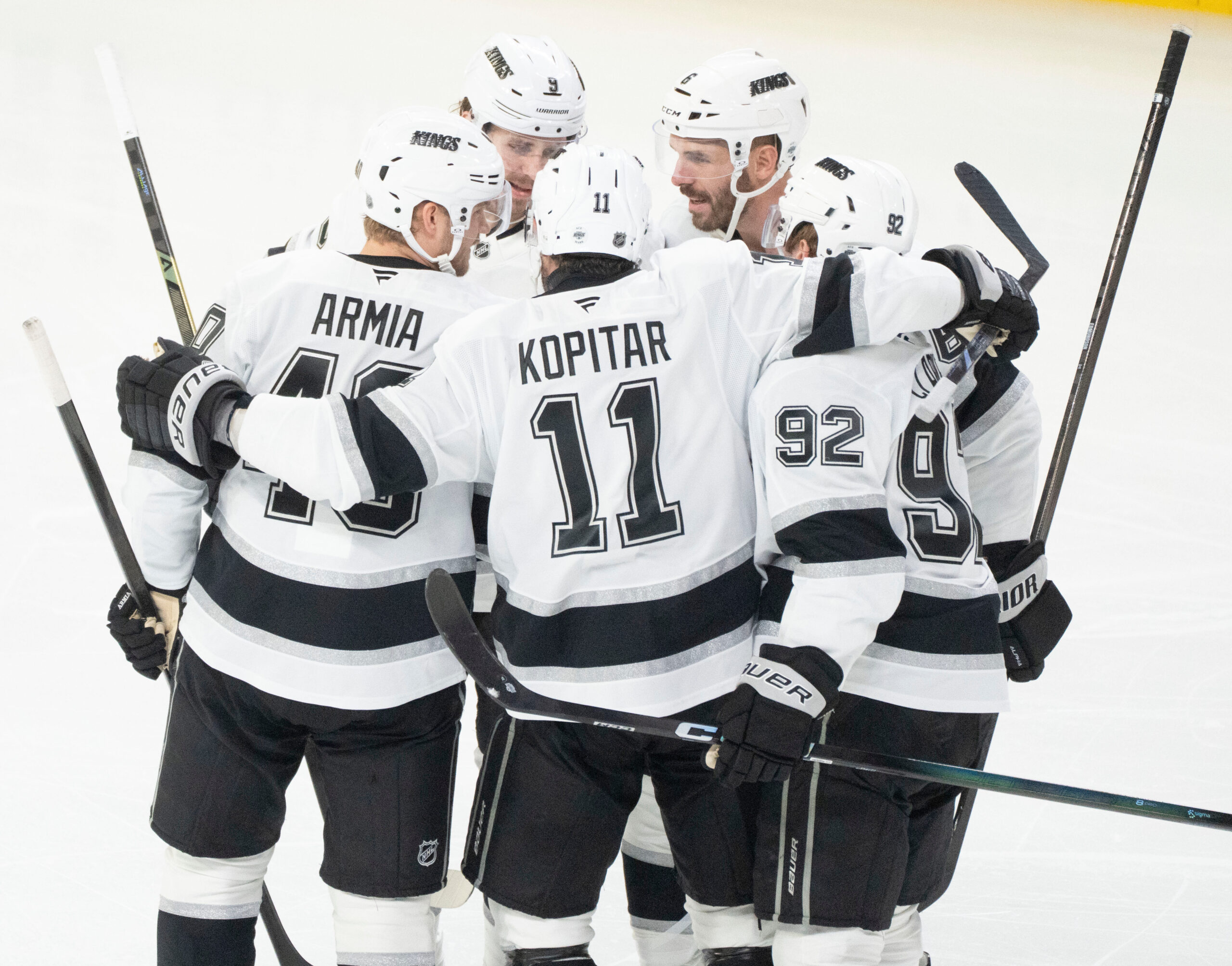 Kings’ Joel Edmundson, top right, celebrates with teammates Brandt Clarke...