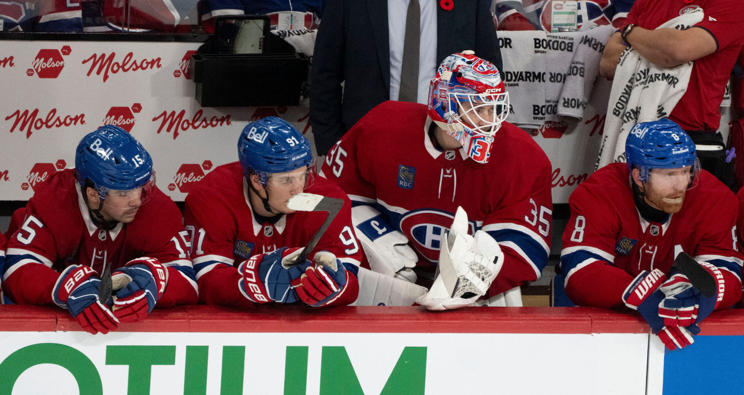 Montreal Canadiens goaltender Sam Montembeault watches from the bench during...