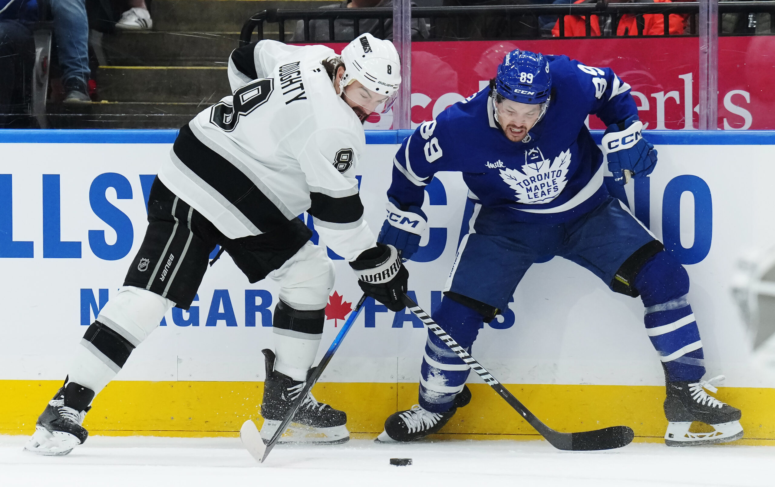 The Kings’ Drew Doughty, left, and the Toronto Maple Leafs’...