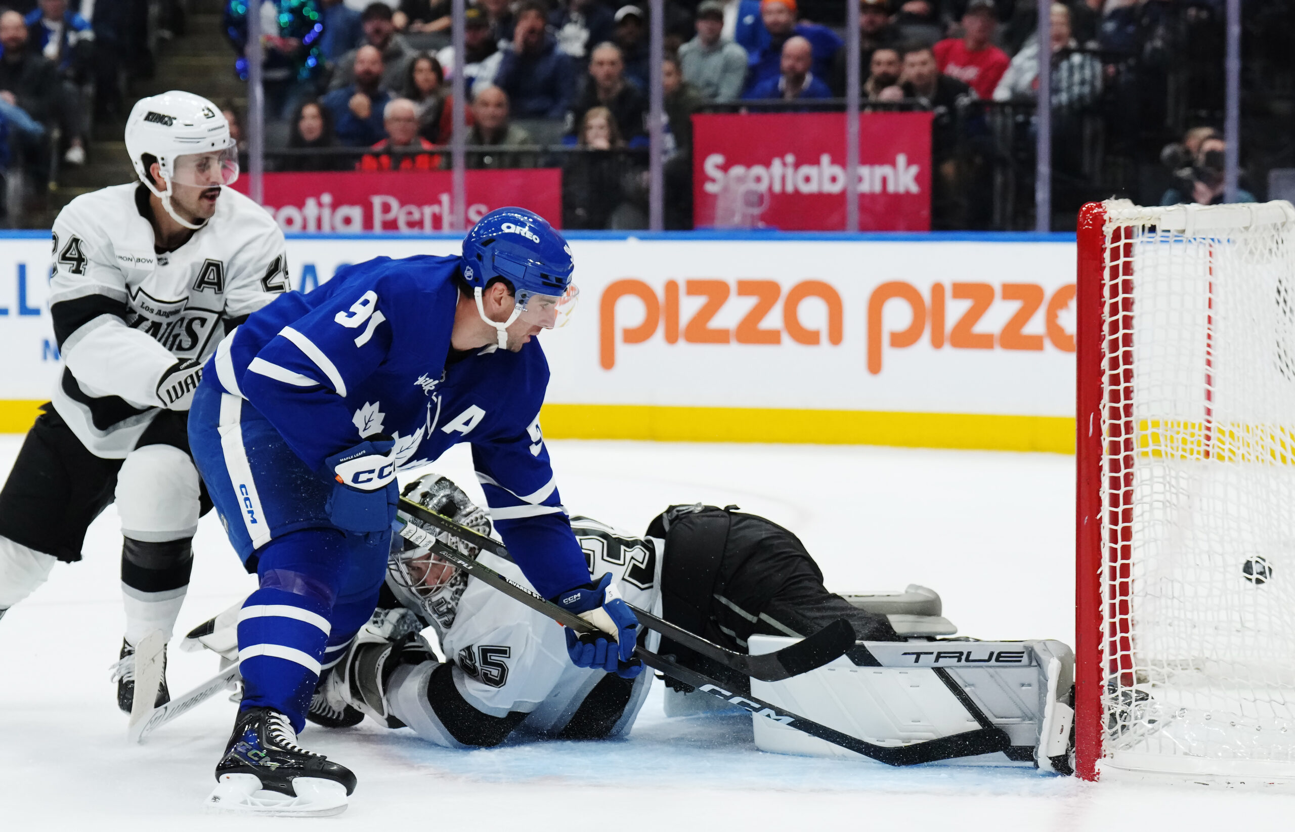 The Toronto Maple Leafs’ John Tavares, left, scores on Kings...