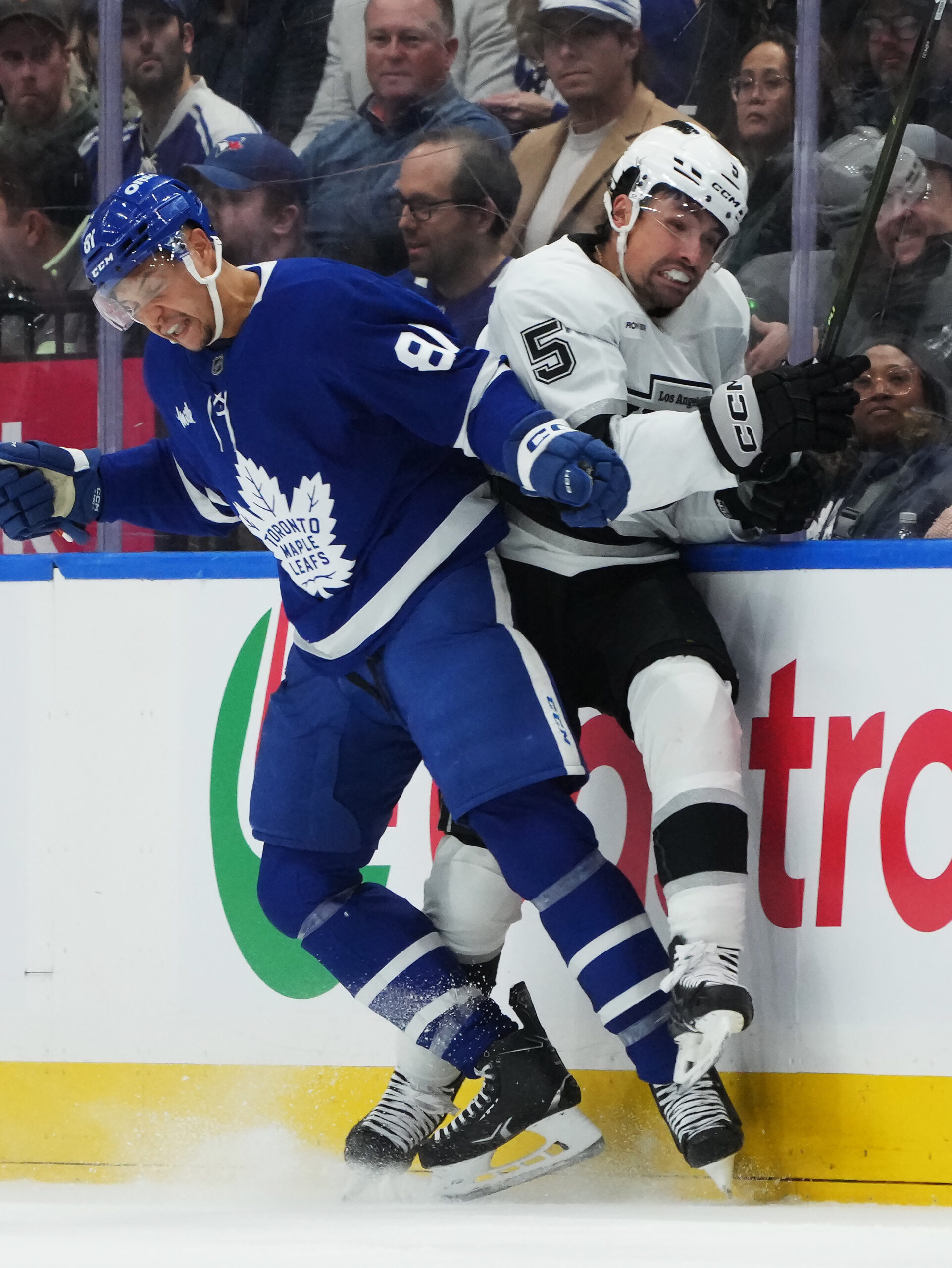 The Toronto Maple Leafs’ Dakota Joshua, left, checks the Kings’...