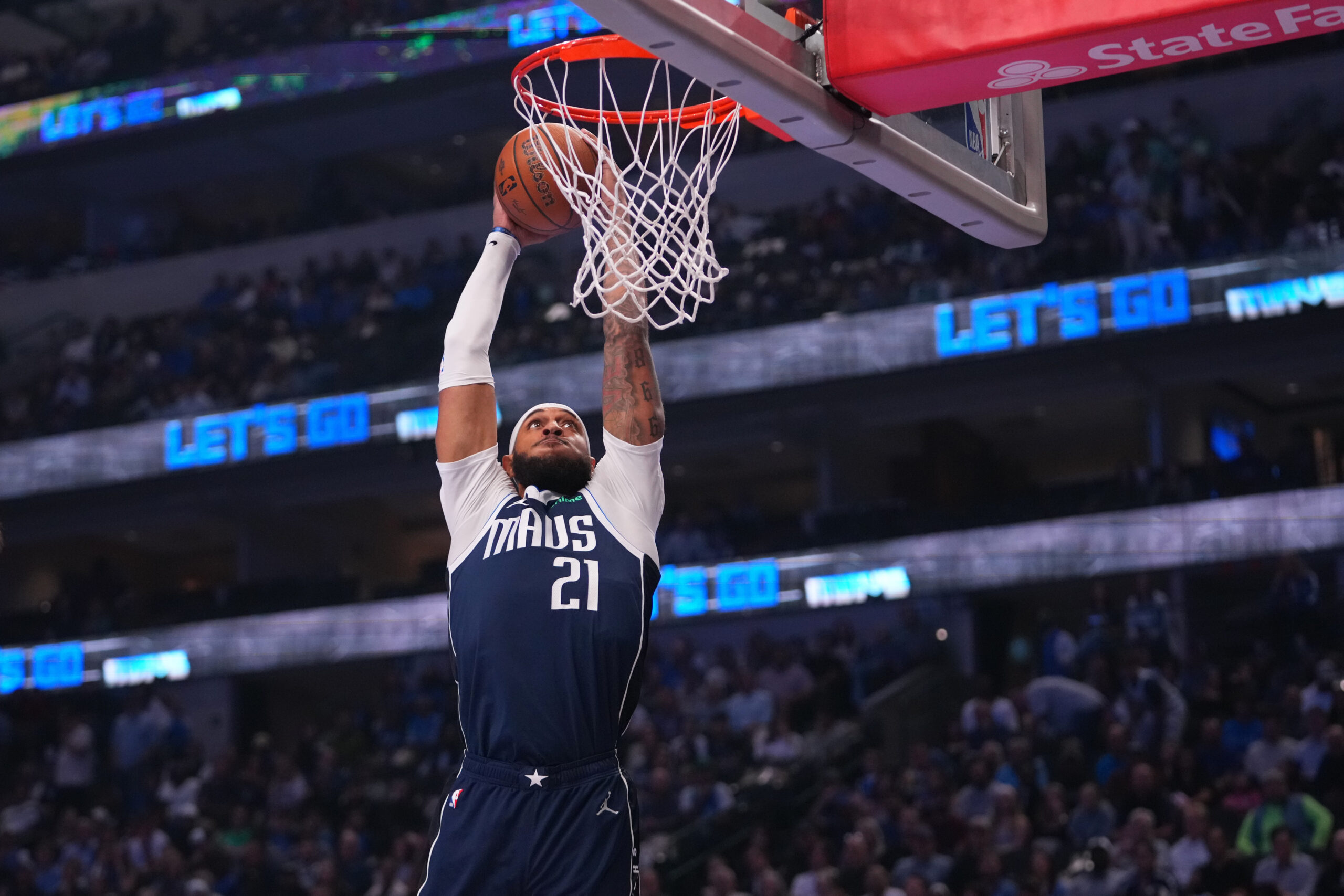 Dallas Mavericks forward Daniel Gafford goes up for a basket...