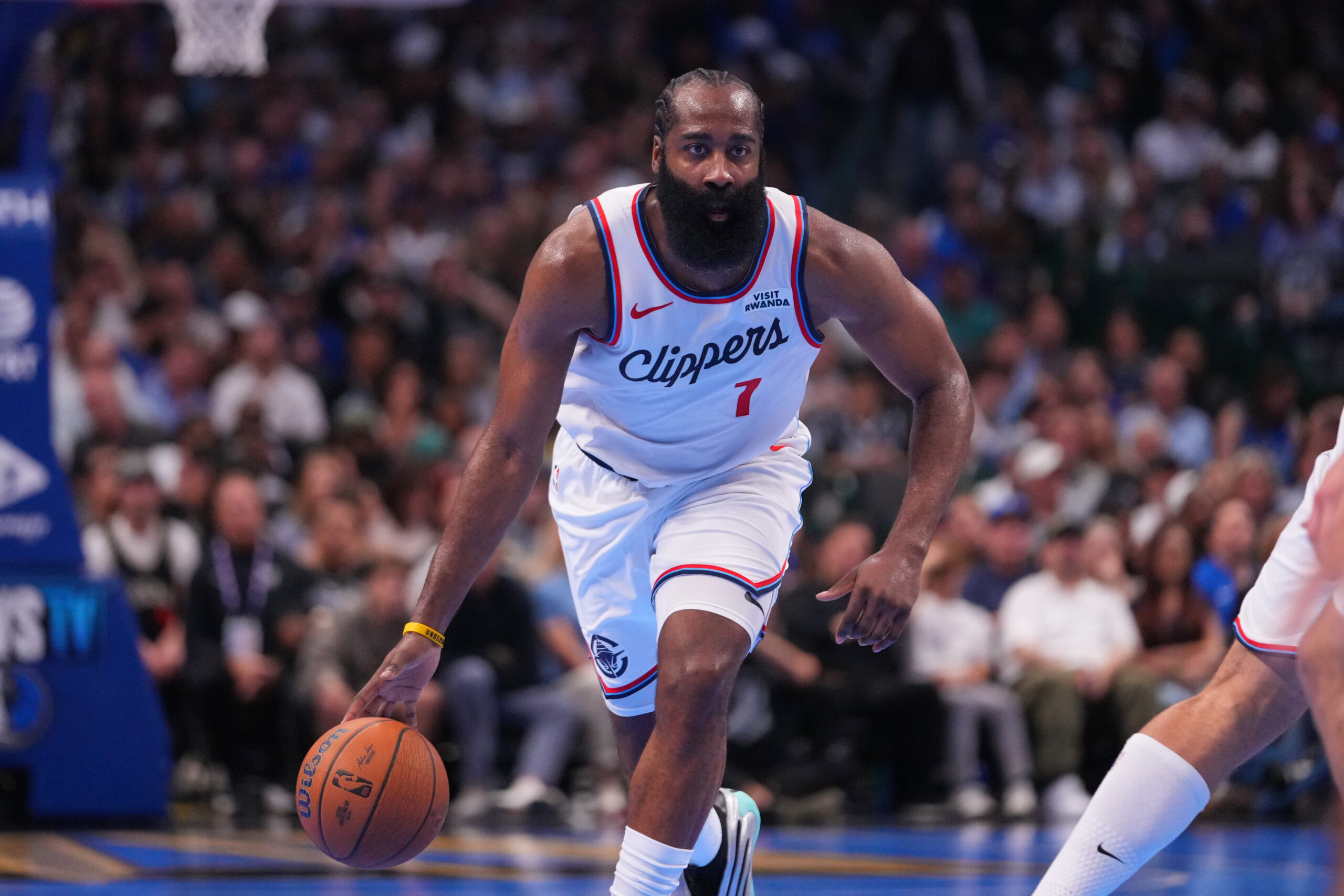 Clippers guard James Harden dribbles up court against the Dallas...