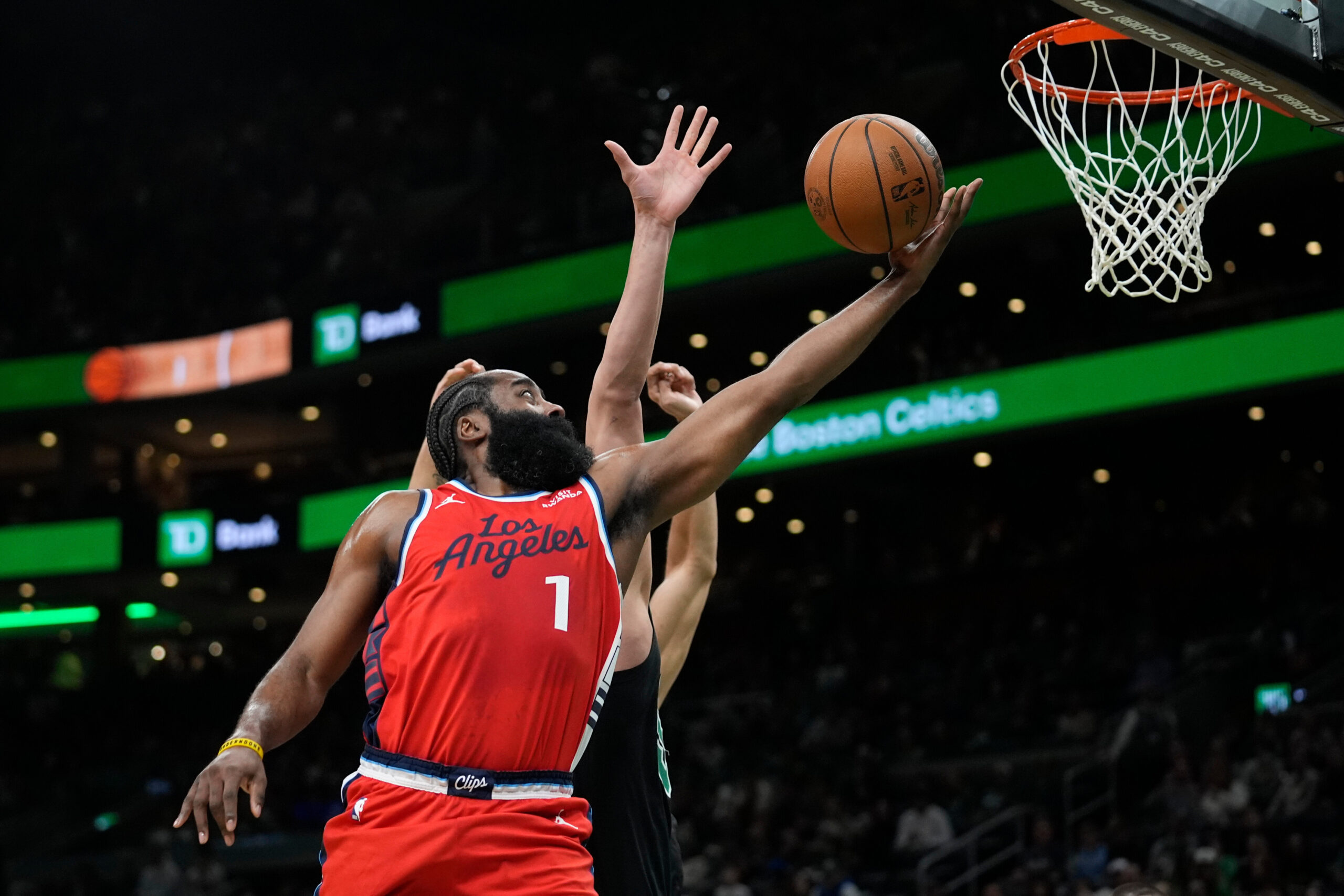 Clippers’ James Harden (1) goes up for a layup against...
