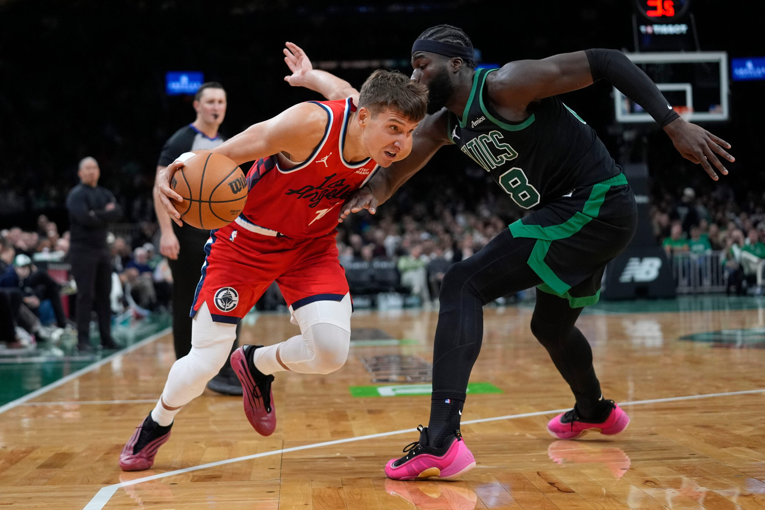 Clippers Bogdan Bogdanovic drives against Boston Celtics center Neemias Queta...
