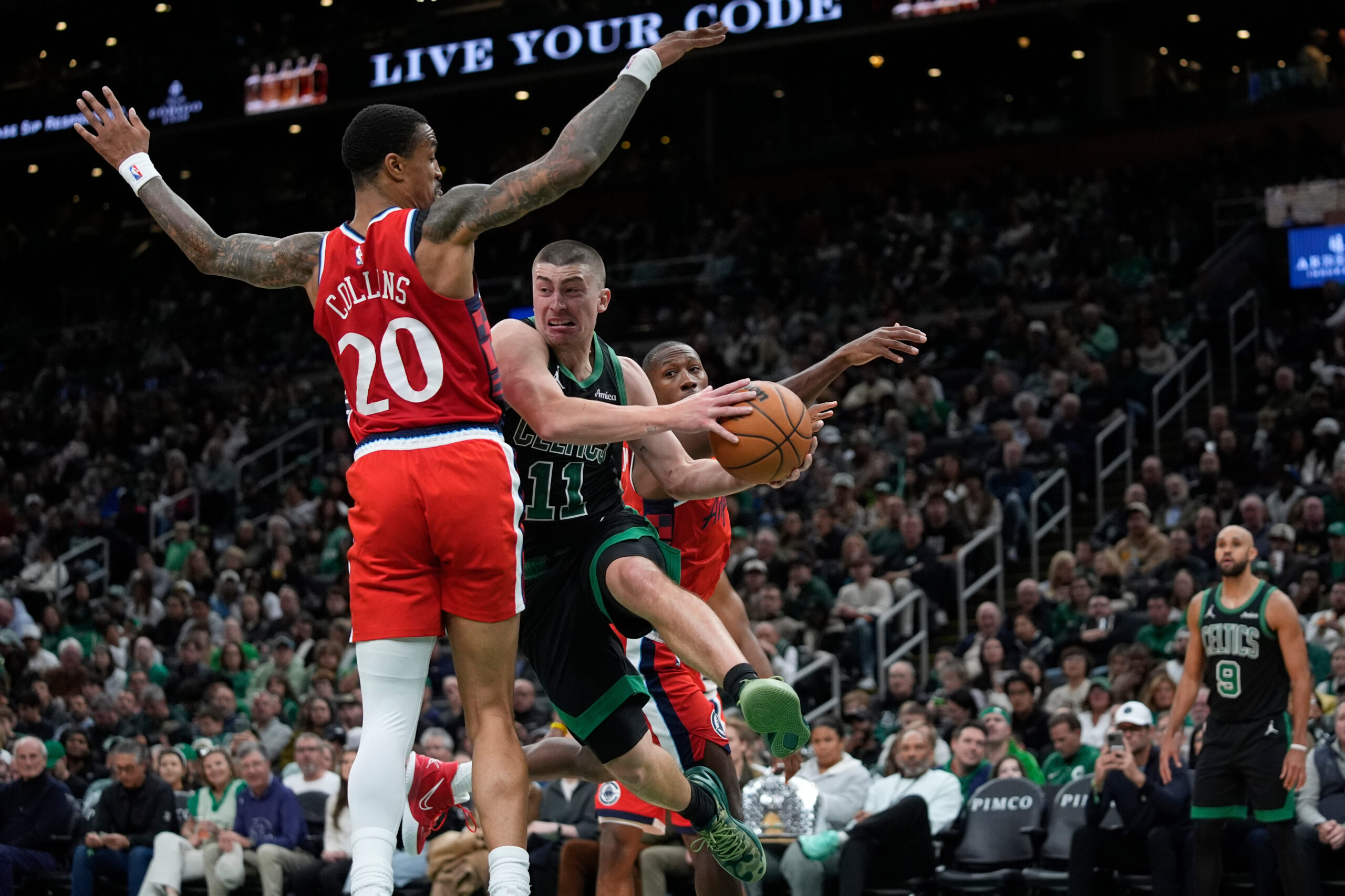 Boston Celtics guard Payton Pritchard looks to pass against Clippers...