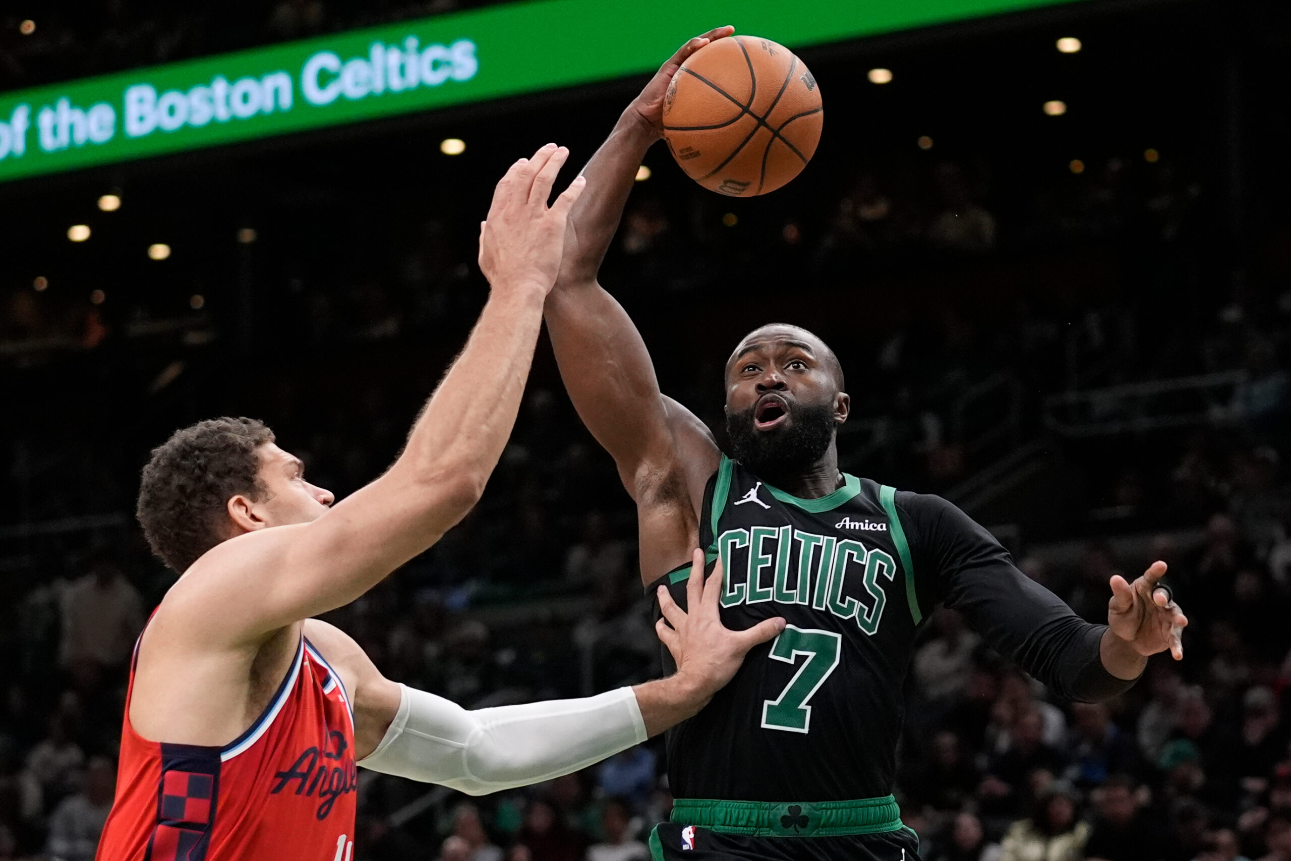 Boston Celtics guard Jaylen Brown (7) is fouled by Clippers...