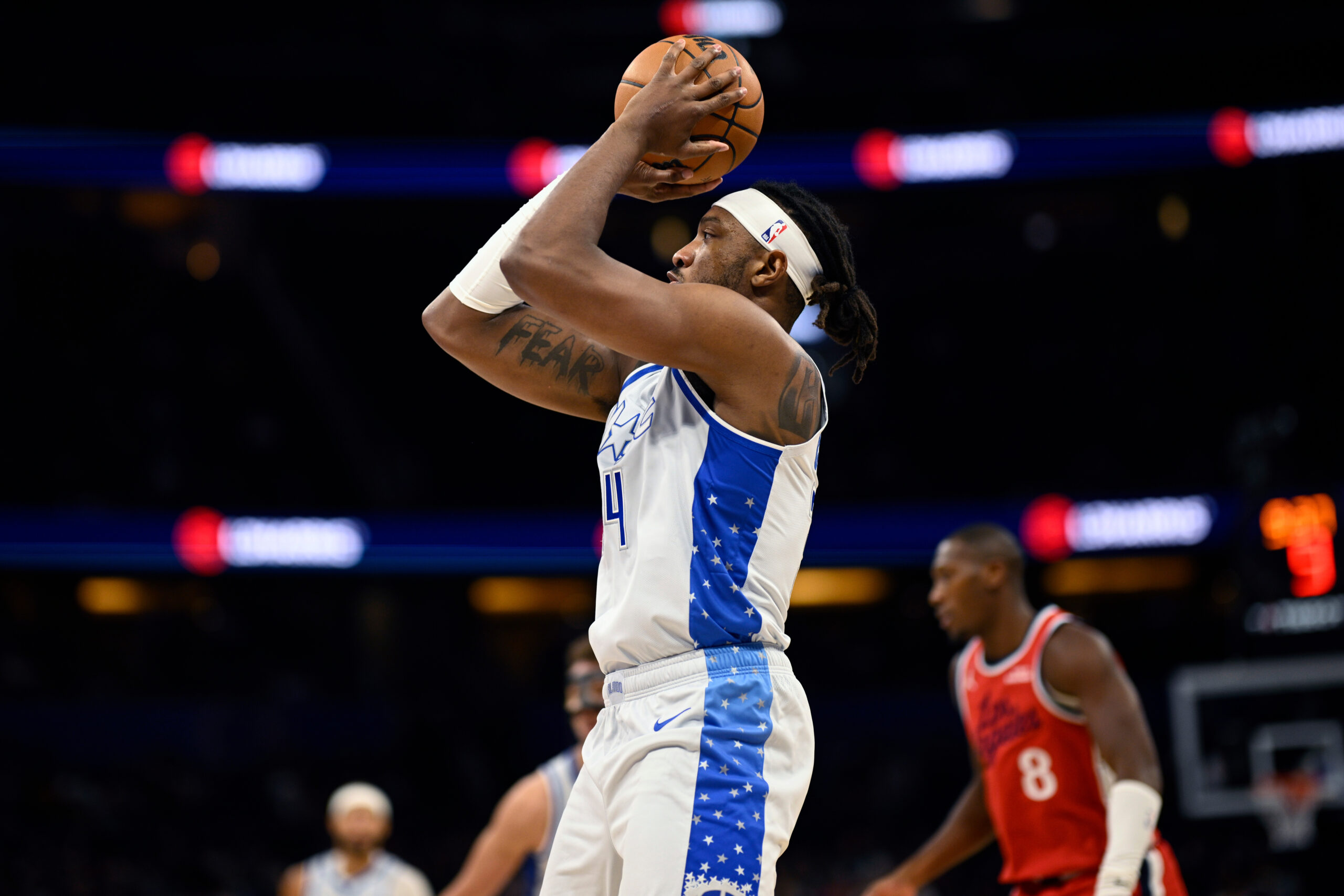 Orlando Magic center Wendell Carter Jr., left, goes up to...