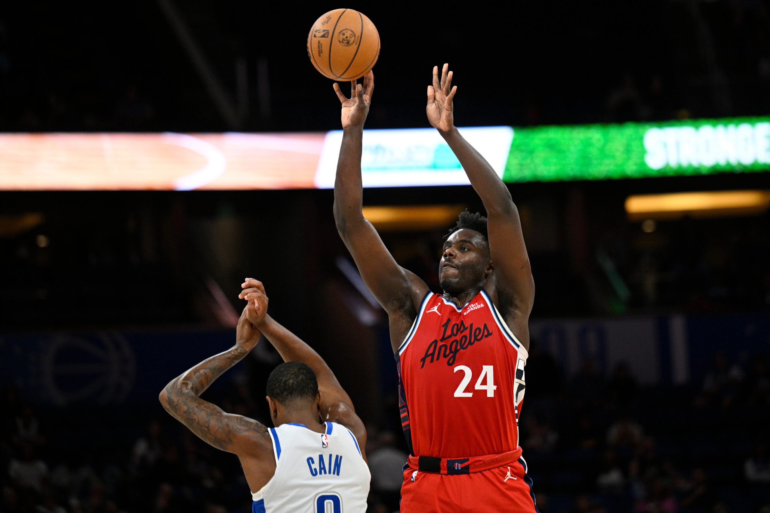 Clippers guard Kobe Brown shoots over Orlando Magic forward Jamal...
