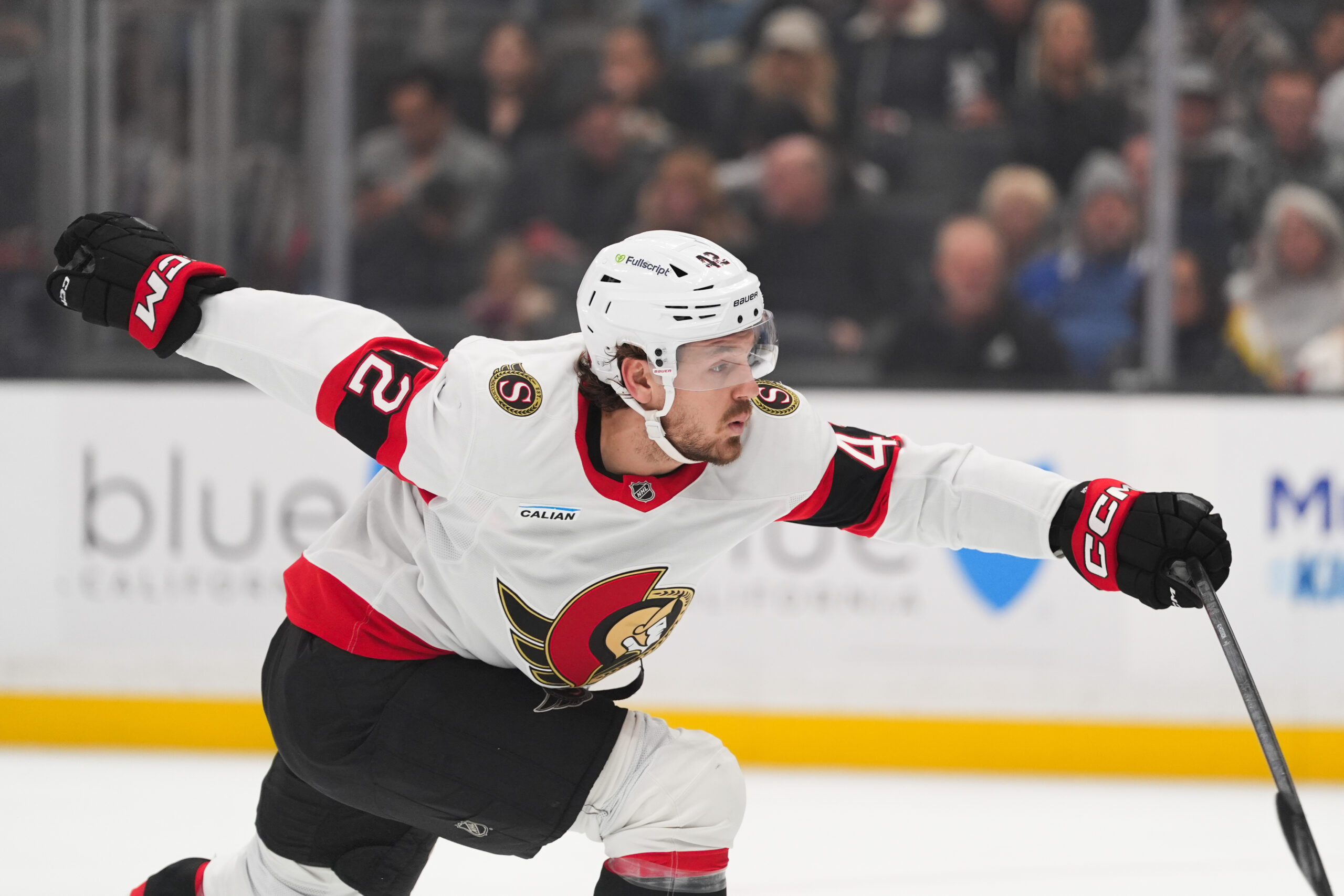 Ottawa Senators right wing Hayden Hodgson reaches for the puck...