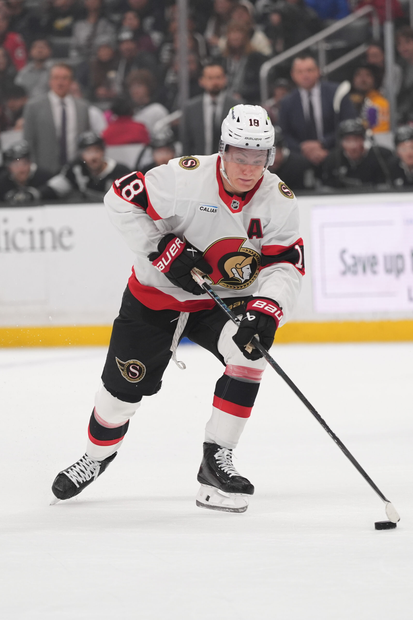 Ottawa Senators center Tim Stützle moves the puck during the...