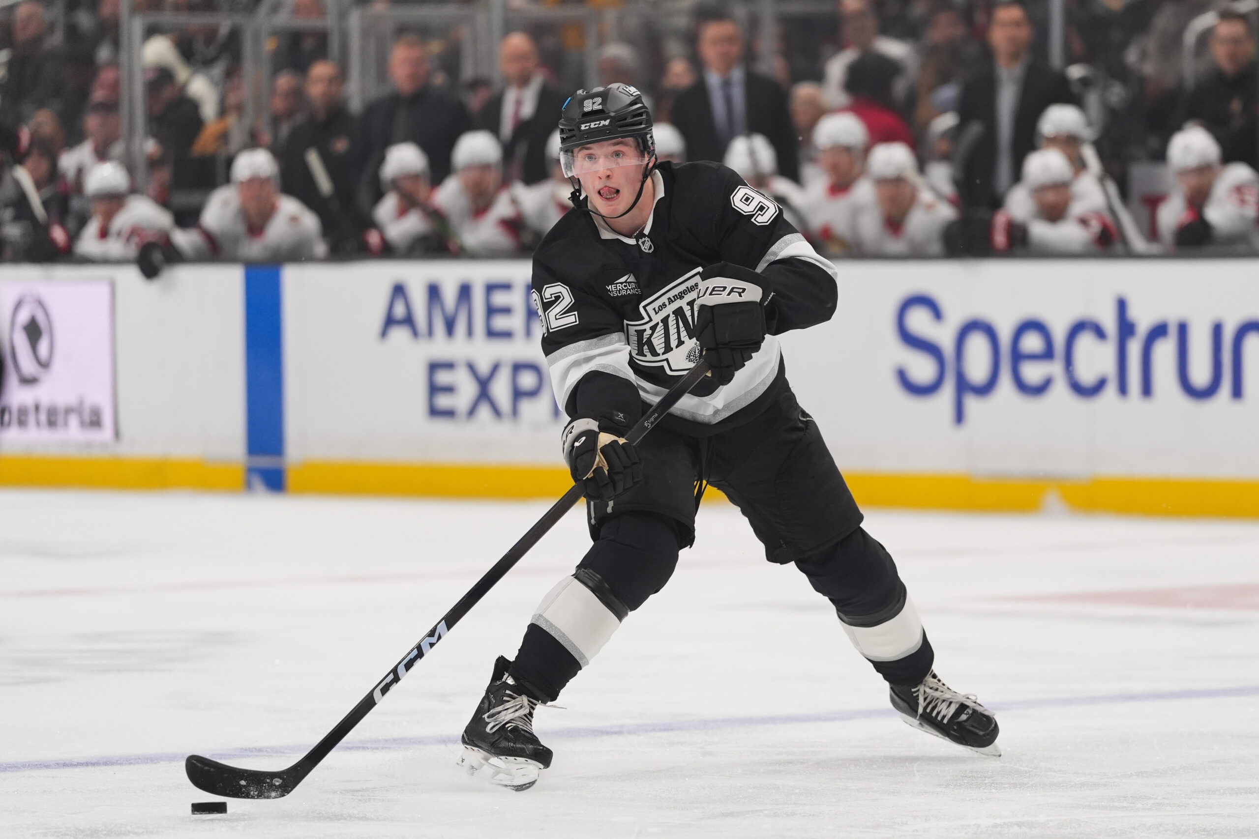 Kings defenseman Brandt Clarke moves the puck during the second...