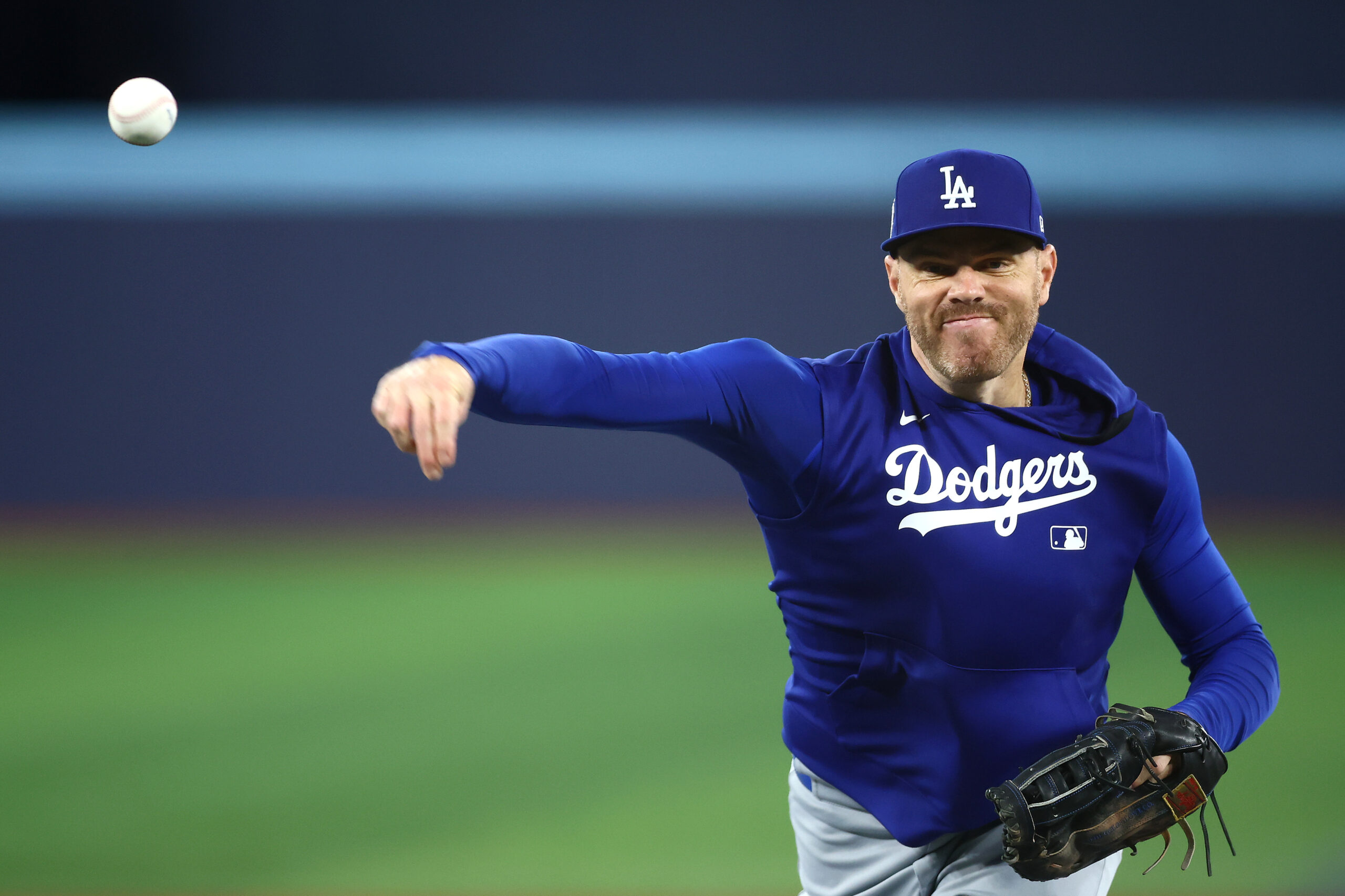 Dodgers first baseman Freddie Freeman warms up before Game 7...