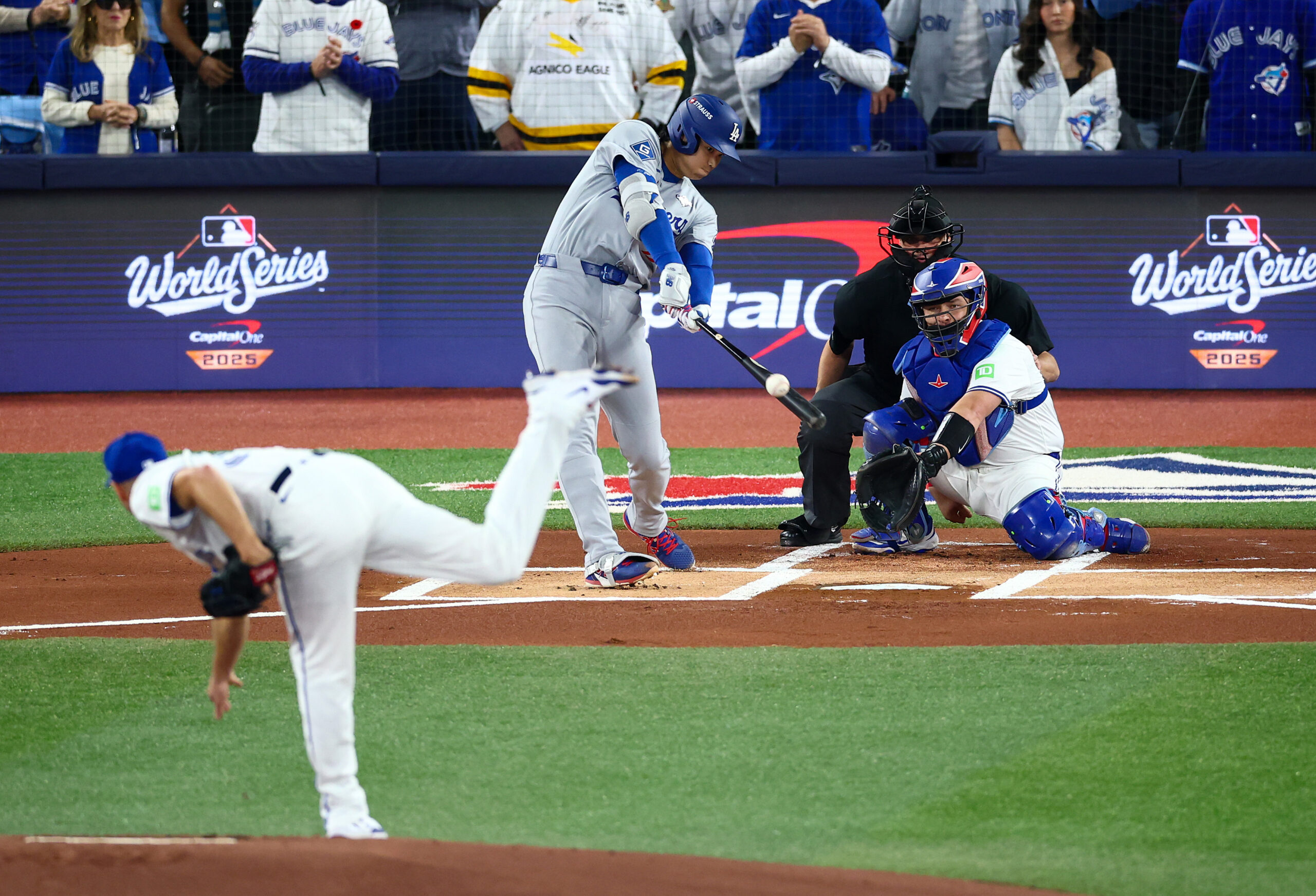 Dodgers star Shohei Ohtani hits a single off of Toronto...
