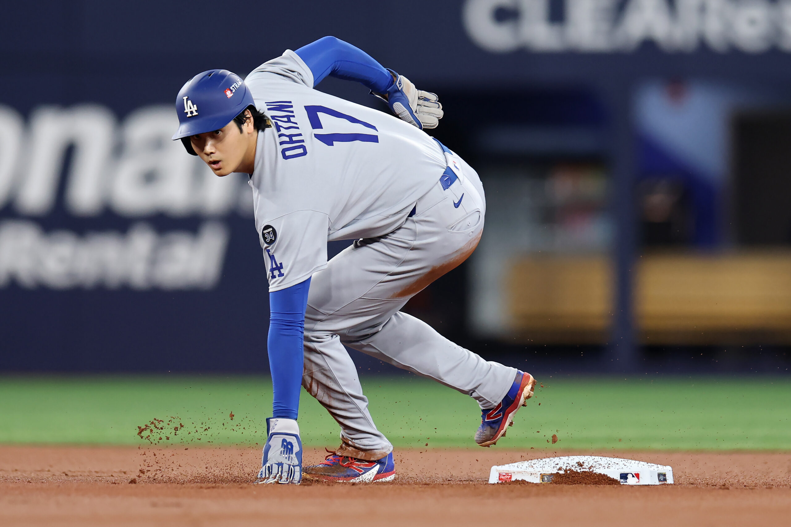 Dodgers star Shohei Ohtani stops at second base during the...