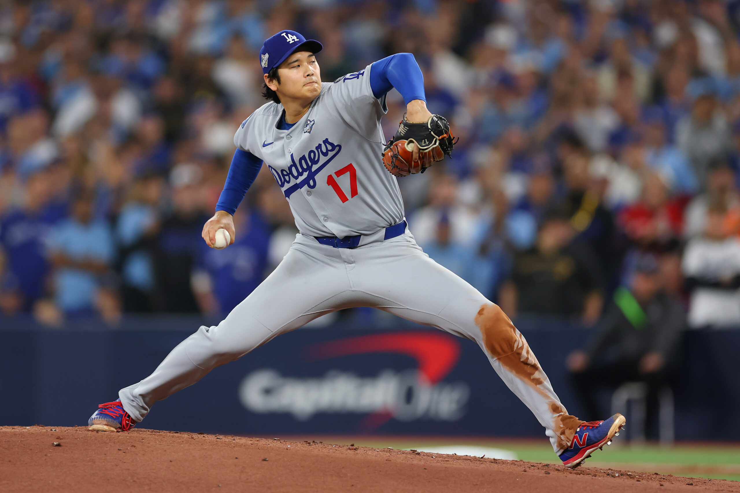 Dodgers starting pitcher Shohei Ohtani throws to the plate during...