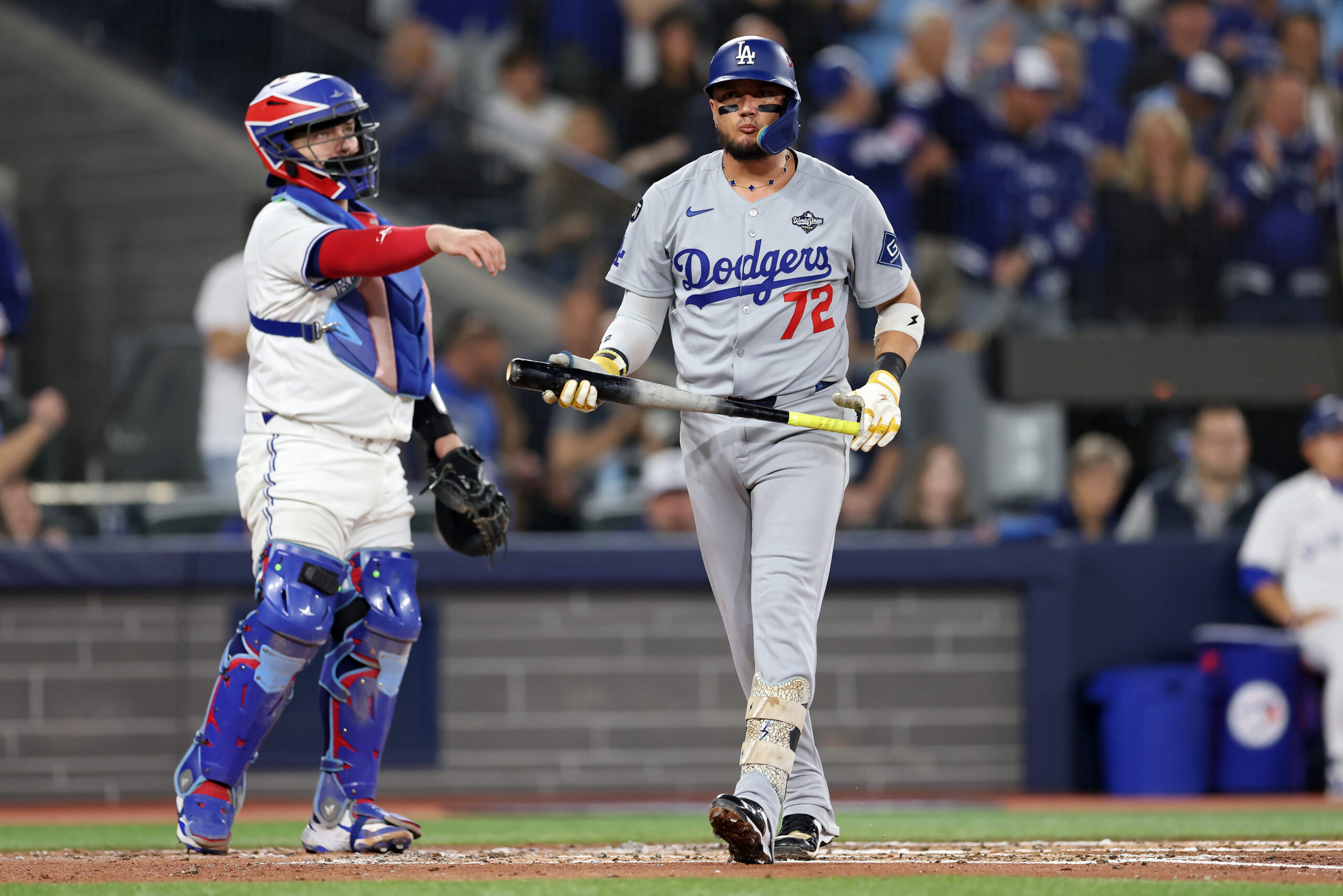 The Dodgers’ Miguel Rojas walks back to the dugout after...