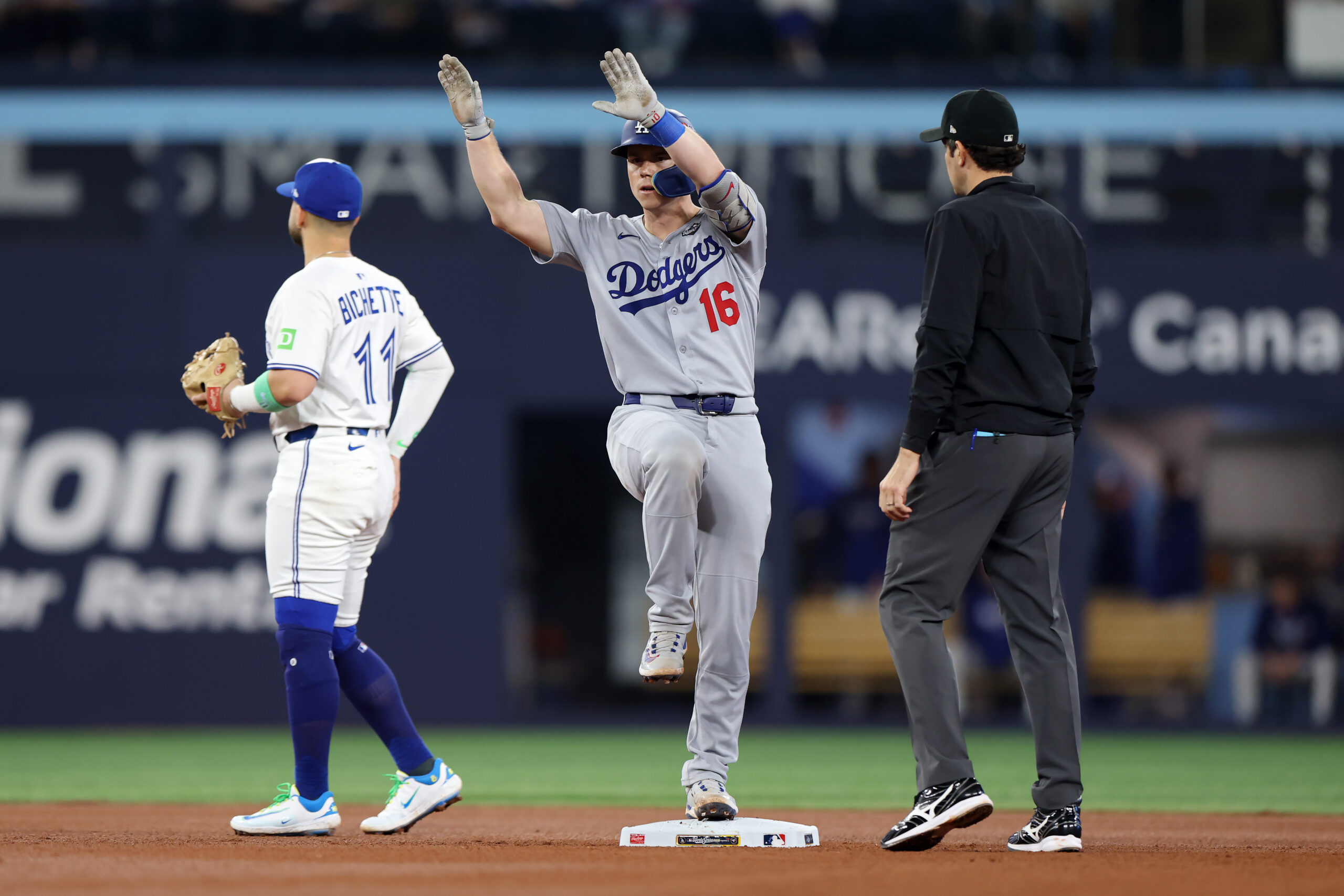 The Dodgers’ Will Smith reacts at second base after hitting...