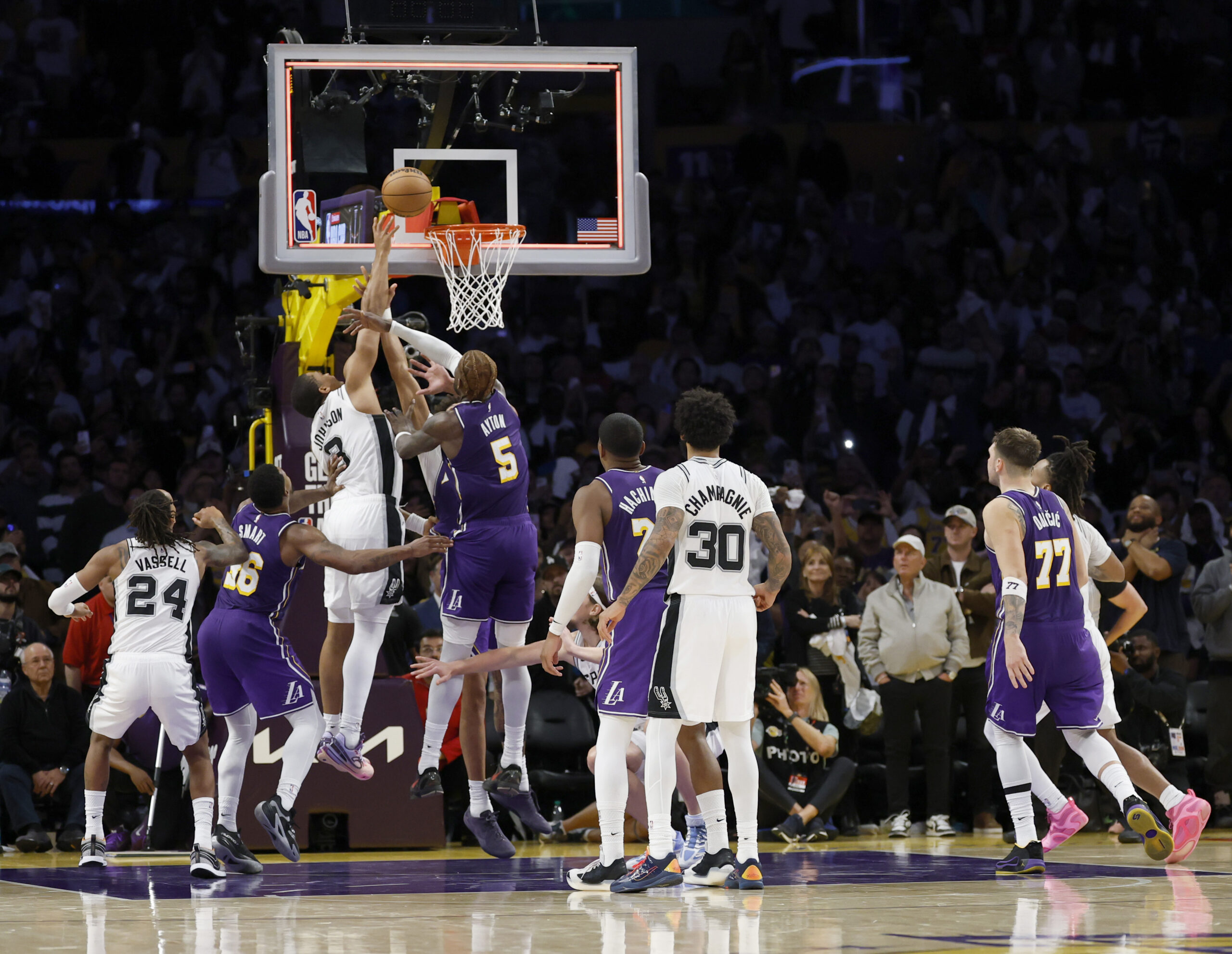 The San Antonio Spurs’ Keldon Johnson (3) misses as he...