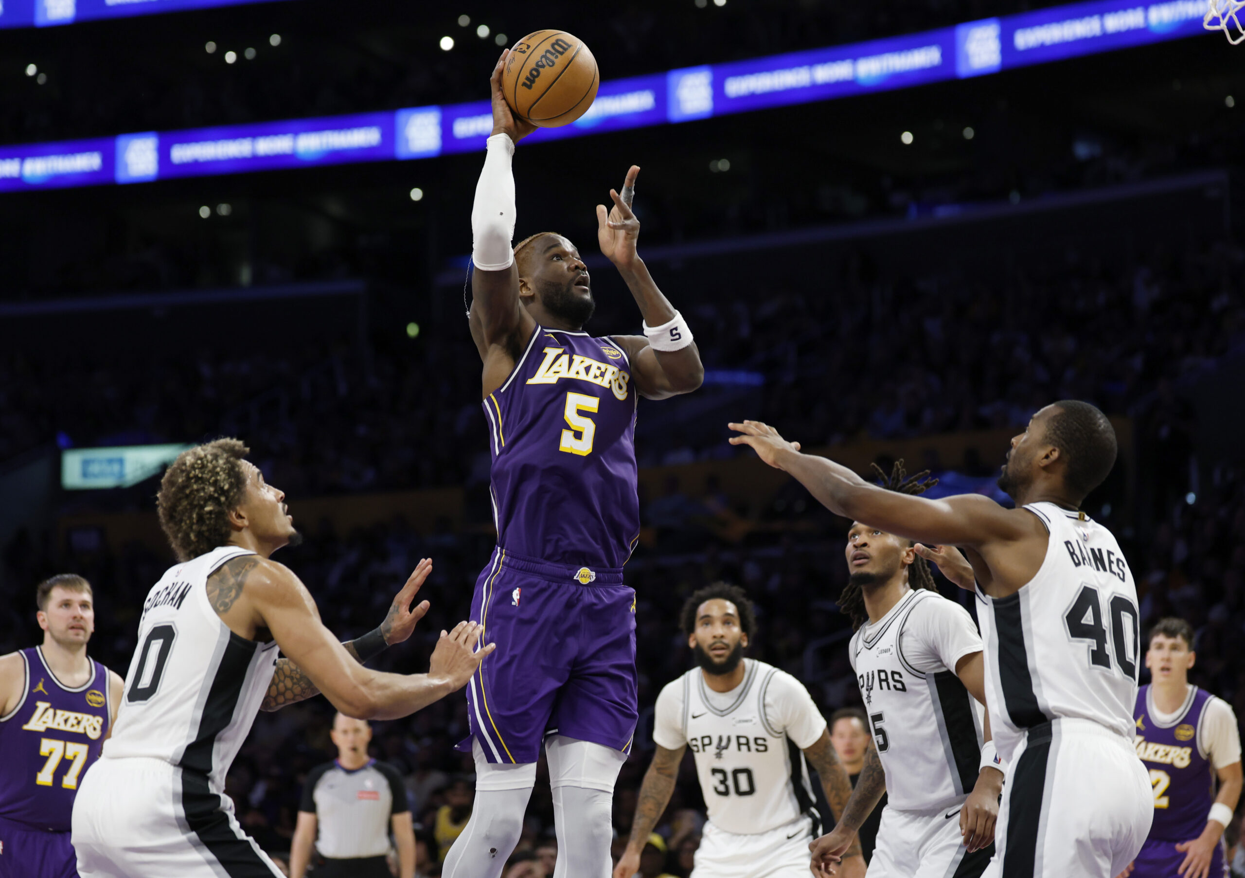 Lakers center Deandre Ayton shoots between the San Antonio Spurs’...