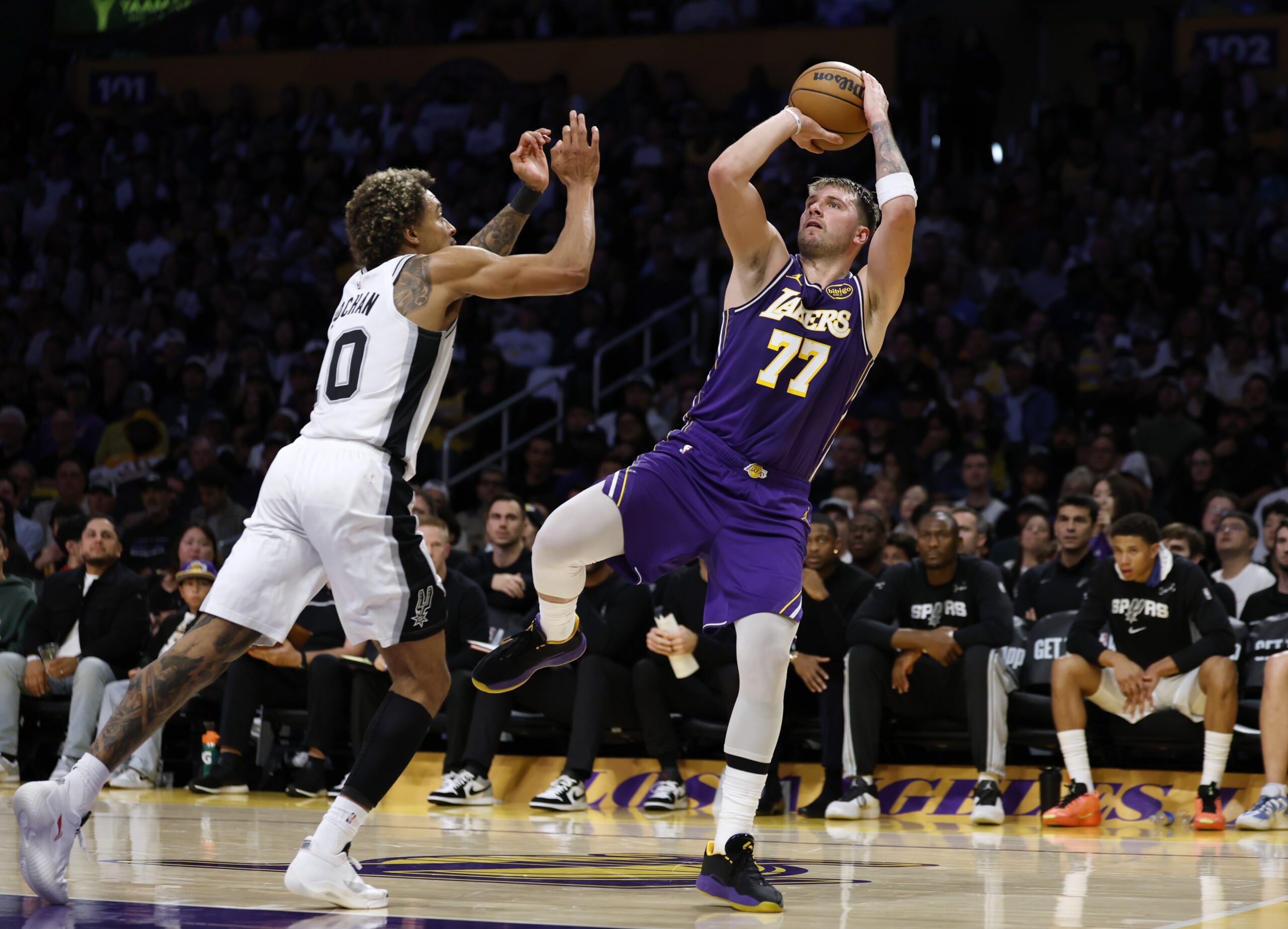 Lakers star Luka Doncic shoots as the San Antonio Spurs’...