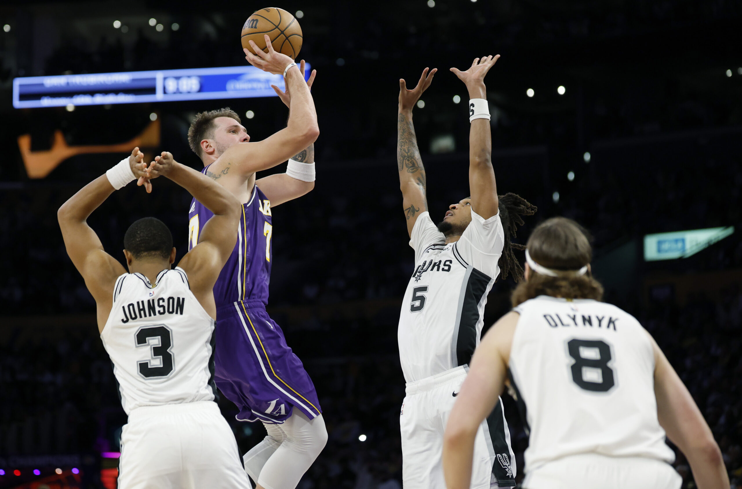 Lakers star Luka Doncic shoots over the San Antonio Spurs’...