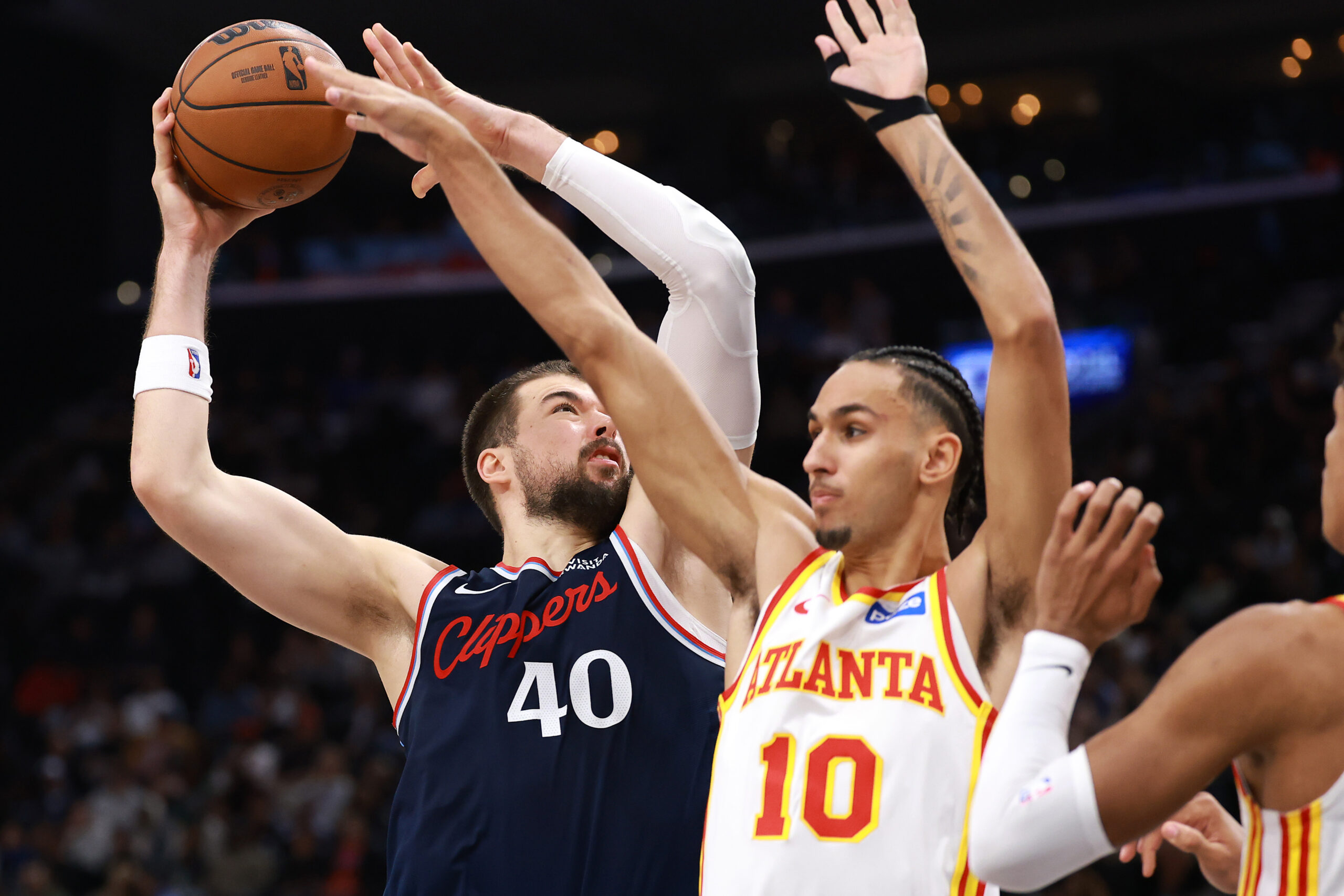 Clippers center Ivica Zubac, left, shoots as the Atlanta Hawks’...