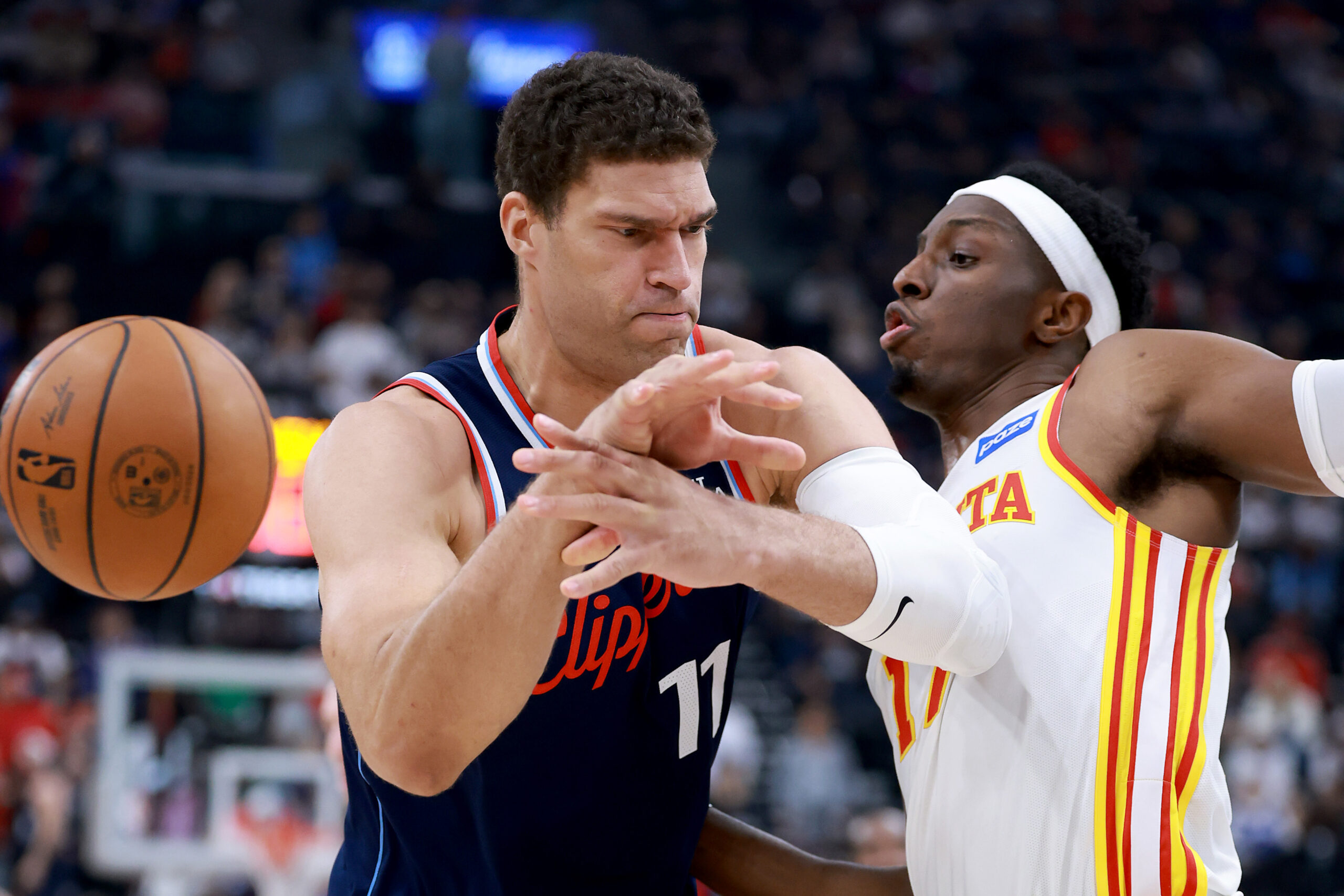 The Atlanta Hawks’ Onyeka Okongwu, right, strips the ball from...