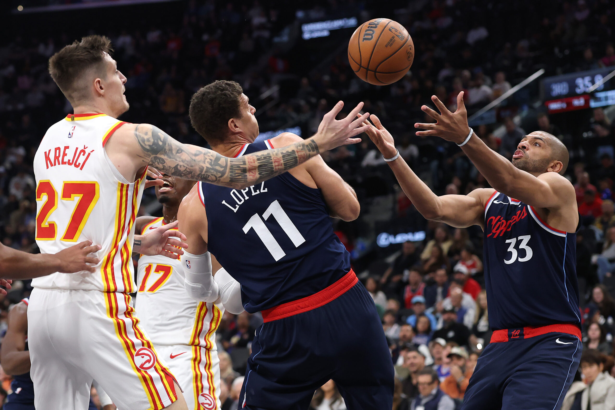 Clippers center Brook Lopez (11) and forward Nicolas Batum, right,...